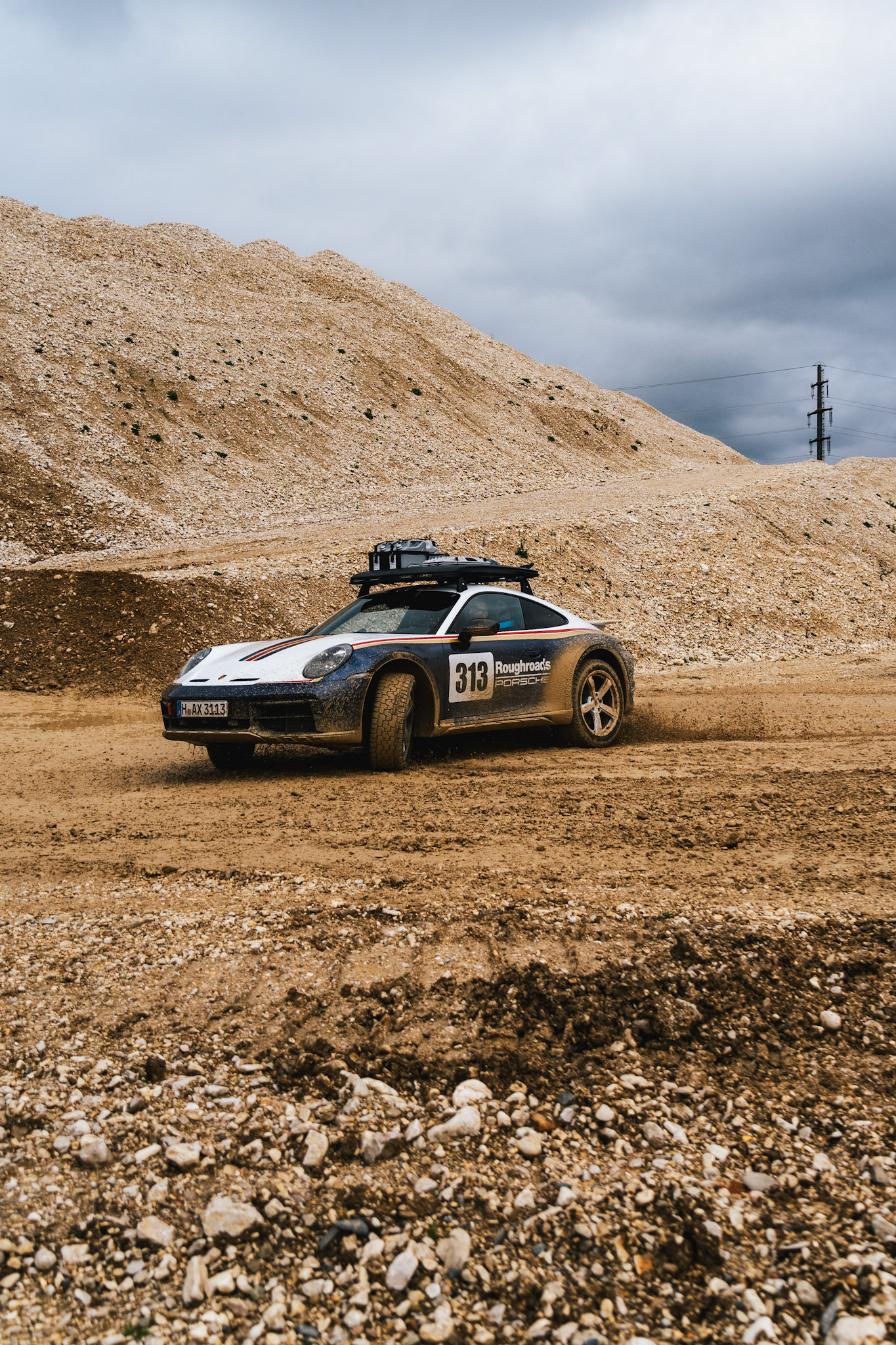 on our road trip from hanover to barcelona with the new porsche 911 dakar, we found a gravel pit in the french-speaking part of switzerland. we just asked if we could test the car a bit... we were allowed to and it was a lot of fun to photograph...