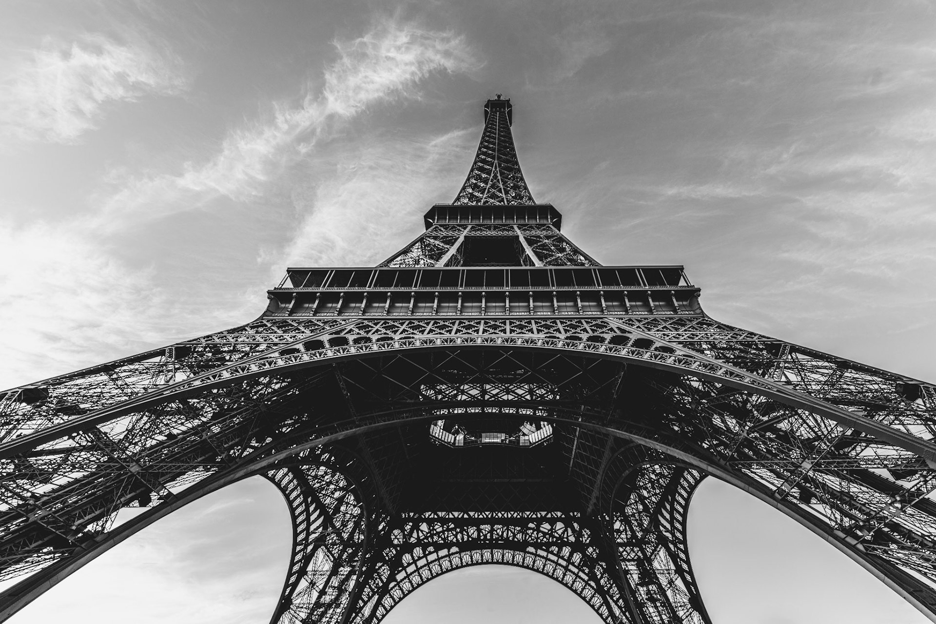 the eiffel tower, an iron giant reaching for the clouds, reveals both its strength and grace when viewed from below. this angle celebrates not only the scale but the delicacy of its latticework, like a piece of intricate lace set against the sky. capturing paris from this perspective gives new life to the city’s most iconic symbol.