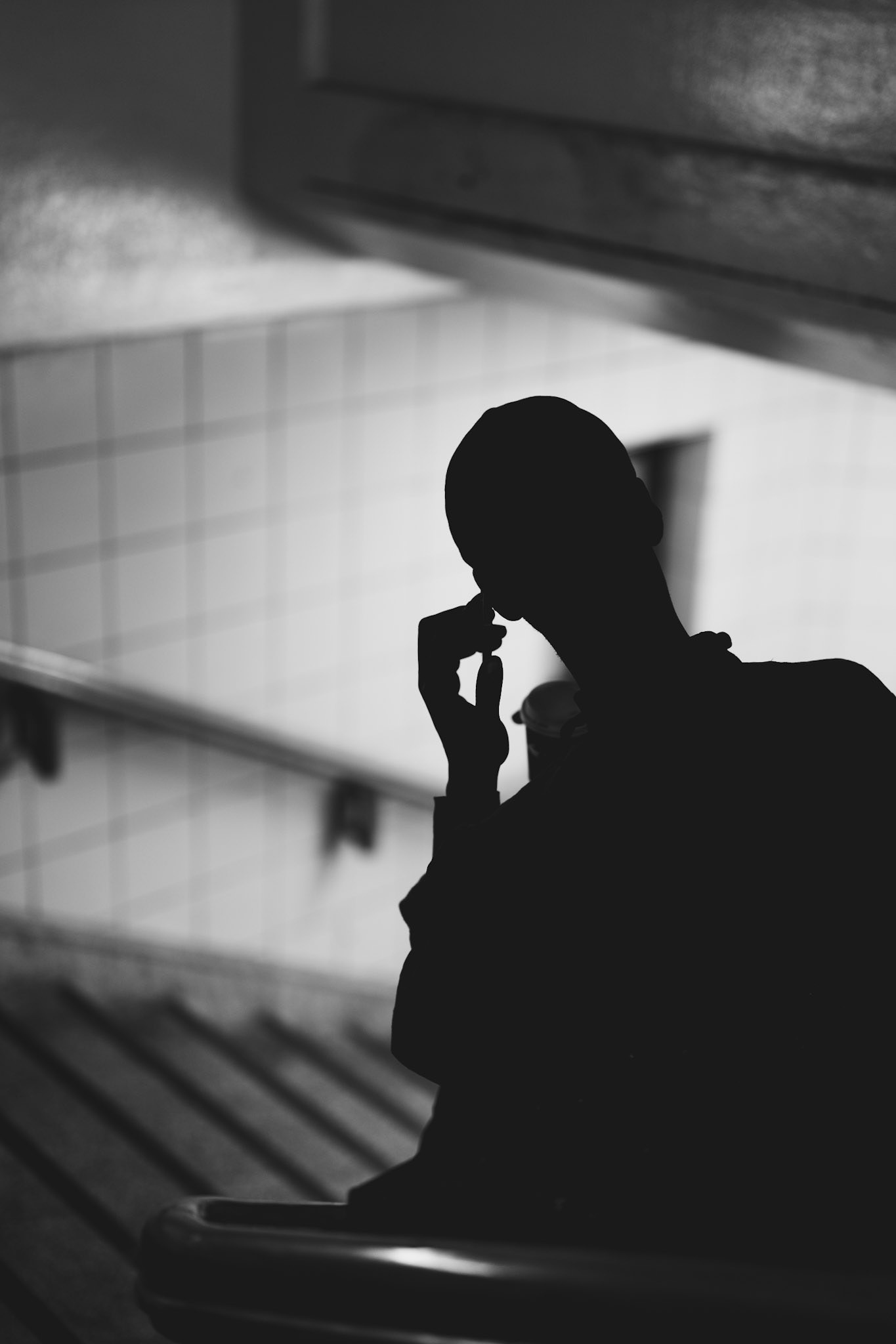 it was one of those moments that only a big city like berlin can offer – silhouettes of people sinking into their thoughts as the evening falls, with traffic rumbling above and flickering lights all around. captured at schlesisches tor station, where the city's pulse is palpable, yet quiet moments like these still find space. the play of light and shadow gives the scene a mysterious edge, as if the figure is just a fleeting thought descending the staircase.