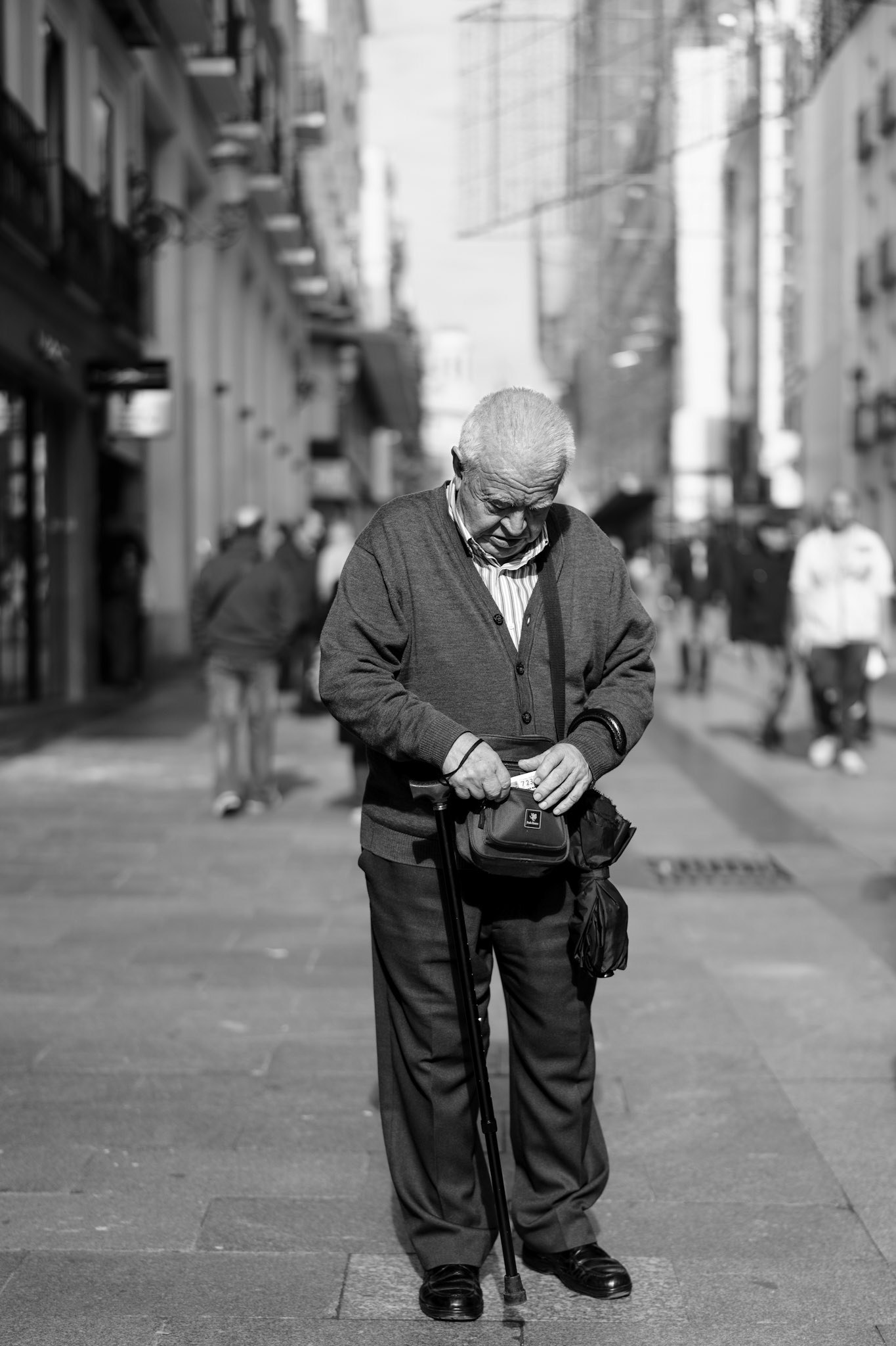 capturing a slice of madrid’s tradition, this image reveals an elderly man on calle del preciados, lost in thought as he searches for his lotterielos—a ticket to the famous “el gordo” christmas lottery, an age-old ritual in spain. against the bustling backdrop of a madrid street, his focus and quiet determination tell a story of hope and custom, shared across generations. through this portrait, a small yet powerful moment emerges, reflecting the personal and cultural significance of lottery season in the heart of madrid.