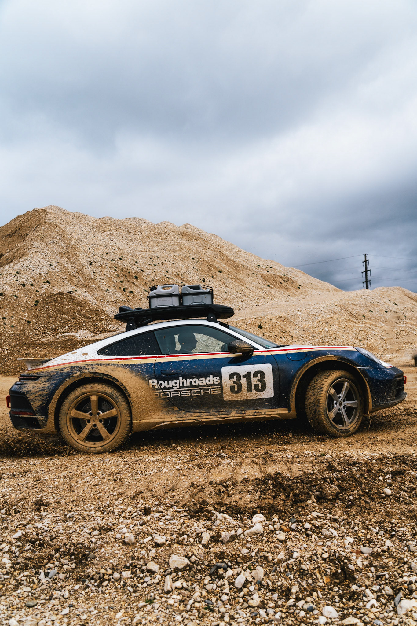 on our road trip from hanover to barcelona with the new porsche 911 dakar, we found a gravel pit in the french-speaking part of switzerland. we just asked if we could test the car a bit... we were allowed to and it was a lot of fun to photograph...