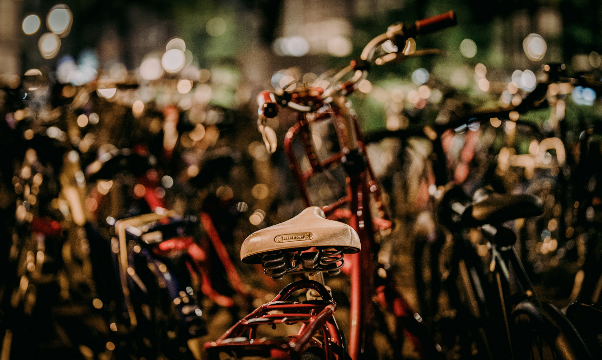 among the sea of forgotten rides, one saddle stands still, waiting for the familiar weight of a journey yet to come. the city buzzes around, but here, there’s a moment of stillness, a pause in the endless rush.