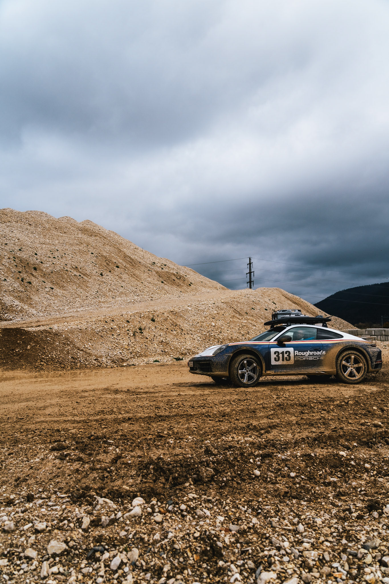 on our road trip from hanover to barcelona with the new porsche 911 dakar, we found a gravel pit in the french-speaking part of switzerland. we just asked if we could test the car a bit... we were allowed to and it was a lot of fun to photograph...