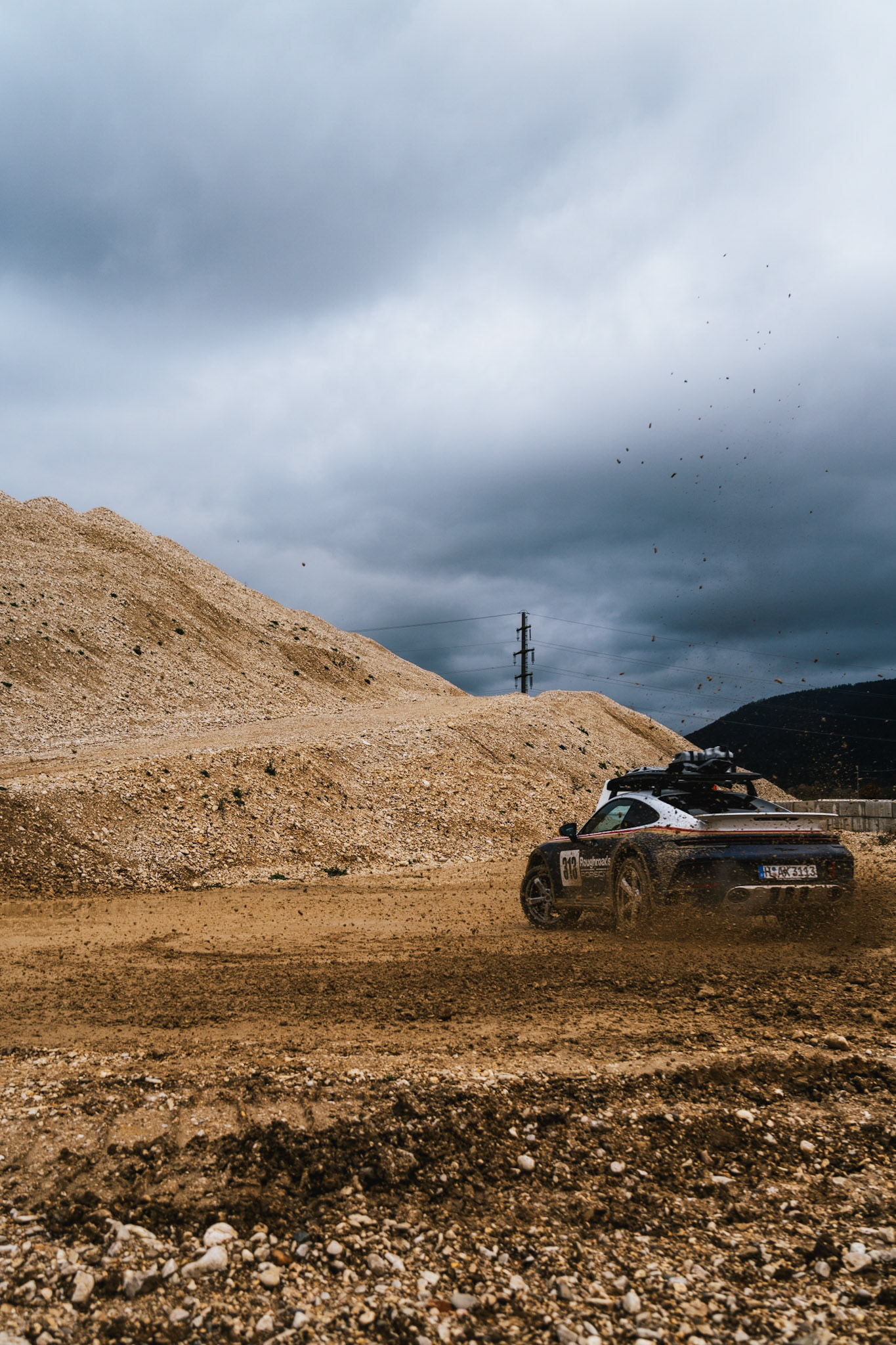 on our road trip from hanover to barcelona with the new porsche 911 dakar, we found a gravel pit in the french-speaking part of switzerland. we just asked if we could test the car a bit... we were allowed to and it was a lot of fun to photograph...