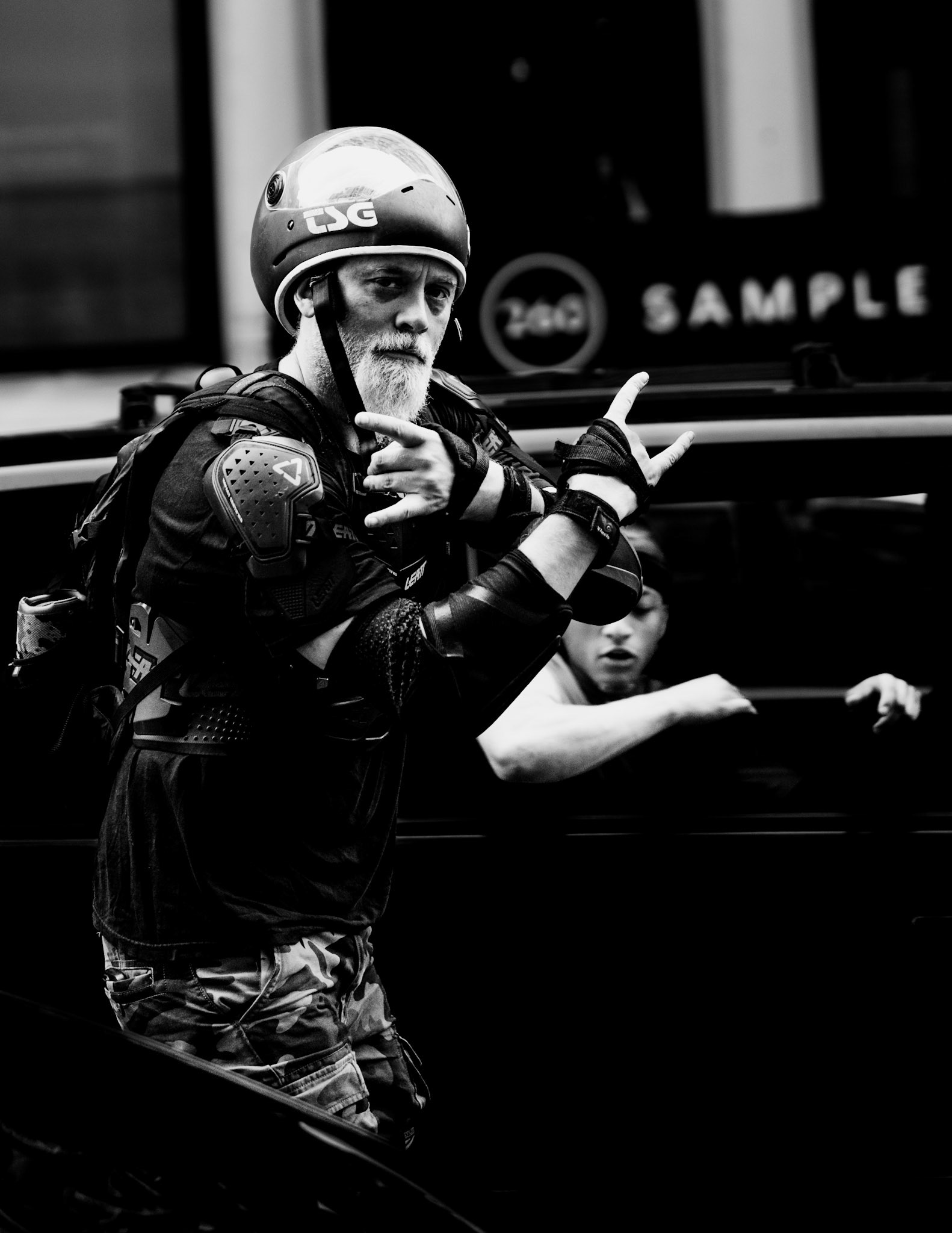 in the heart of broadway, a moment of sheer serendipity unfolded as i captured this striking skater, his silver beard gleaming against his armored attire. the juxtaposition of his youthful spirit with his seasoned face spoke volumes about the timeless nature of passion. my camera, almost an extension of my arm, effortlessly followed his movement, immortalizing his spontaneous gesture and the intensity in his eyes. this shot encapsulates the raw energy and unexpected encounters that make street photography so exhilarating.