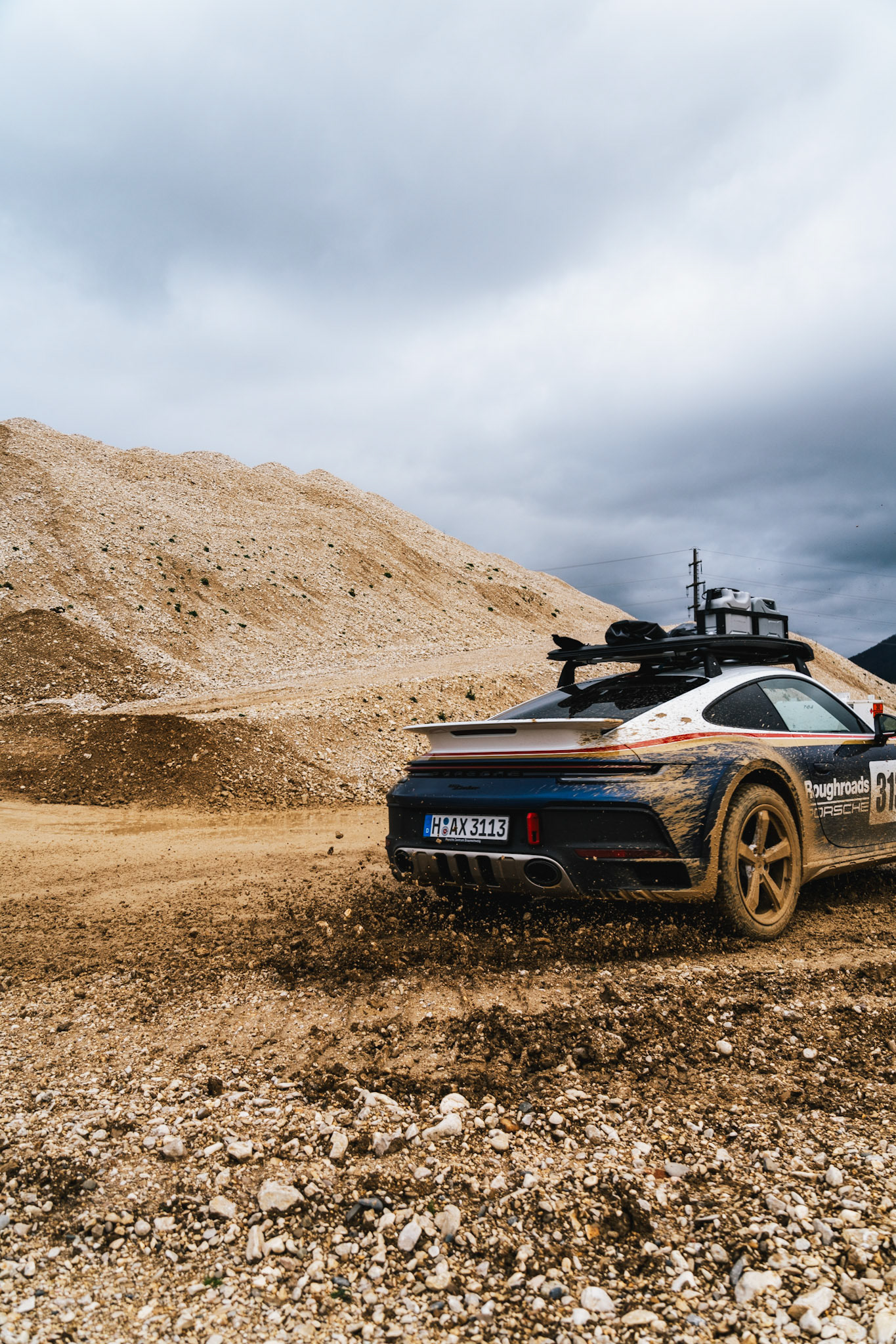 on our road trip from hanover to barcelona with the new porsche 911 dakar, we found a gravel pit in the french-speaking part of switzerland. we just asked if we could test the car a bit... we were allowed to and it was a lot of fun to photograph...