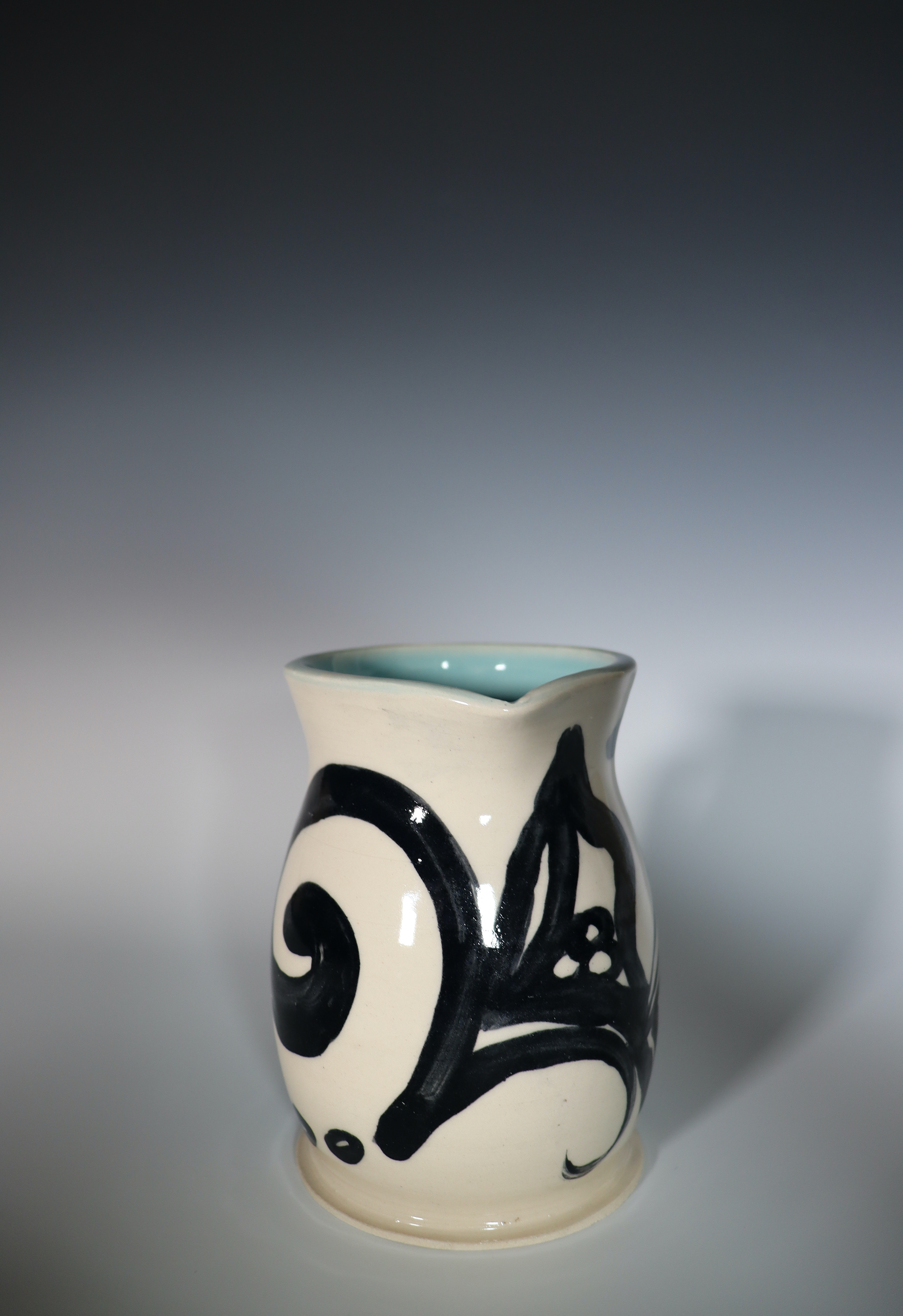 "In Pursuit of" Underglaze painting and carvings on Mid-Fire Clay, 2025