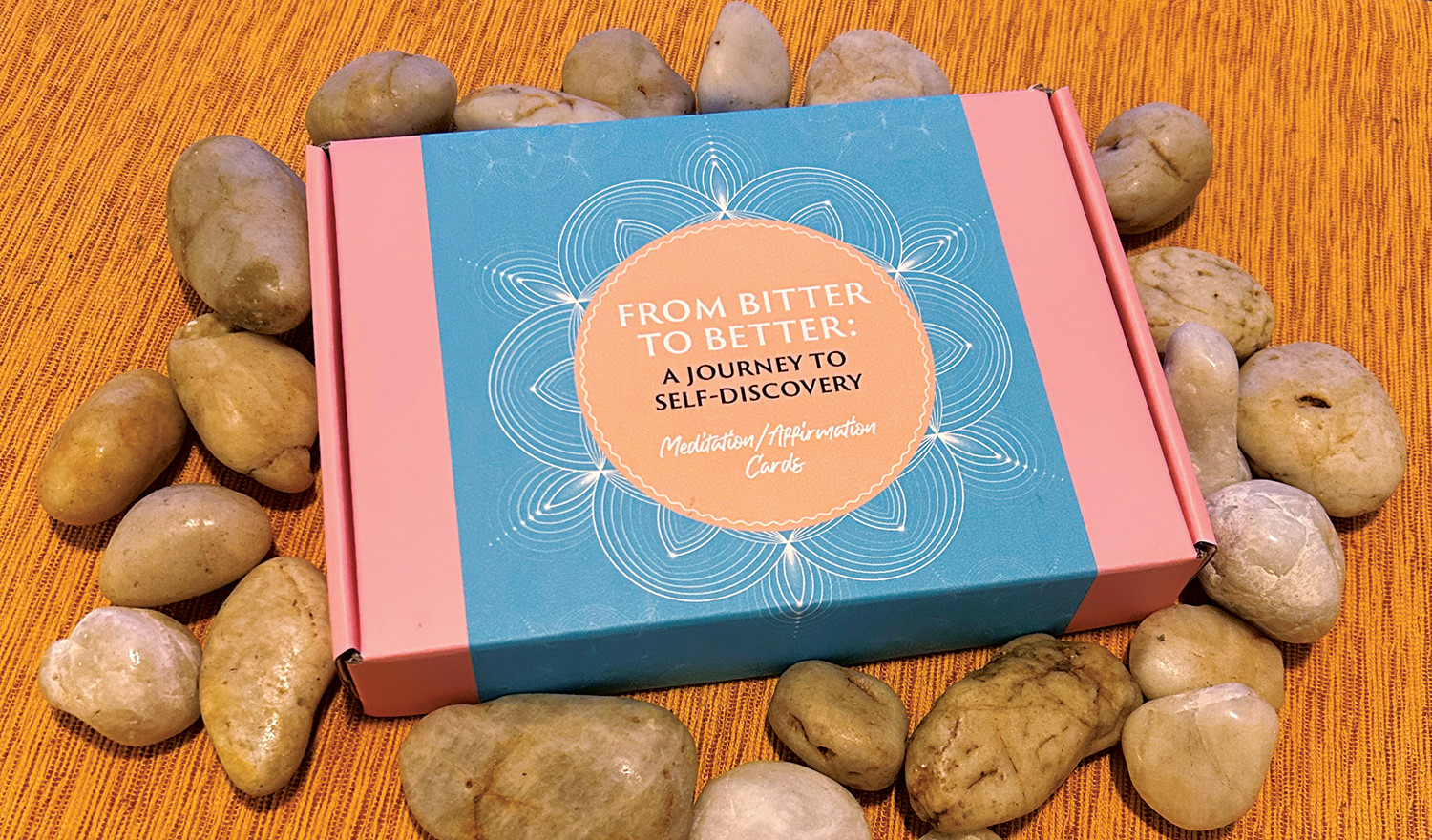 handmade box for affirmation cards for from bitter to better set on top of several stones