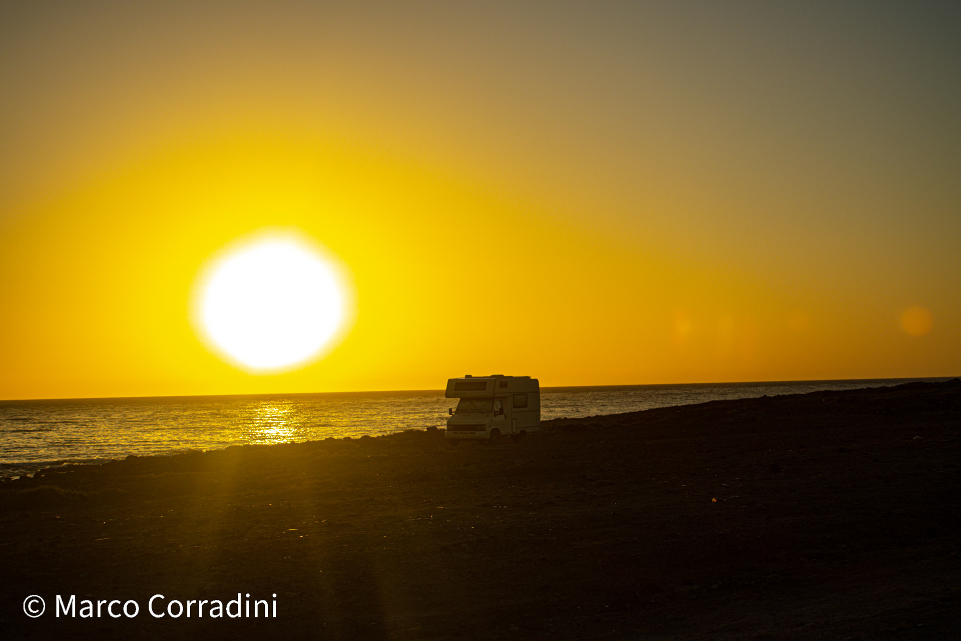 A motorhome at dawn in Playa Blanca