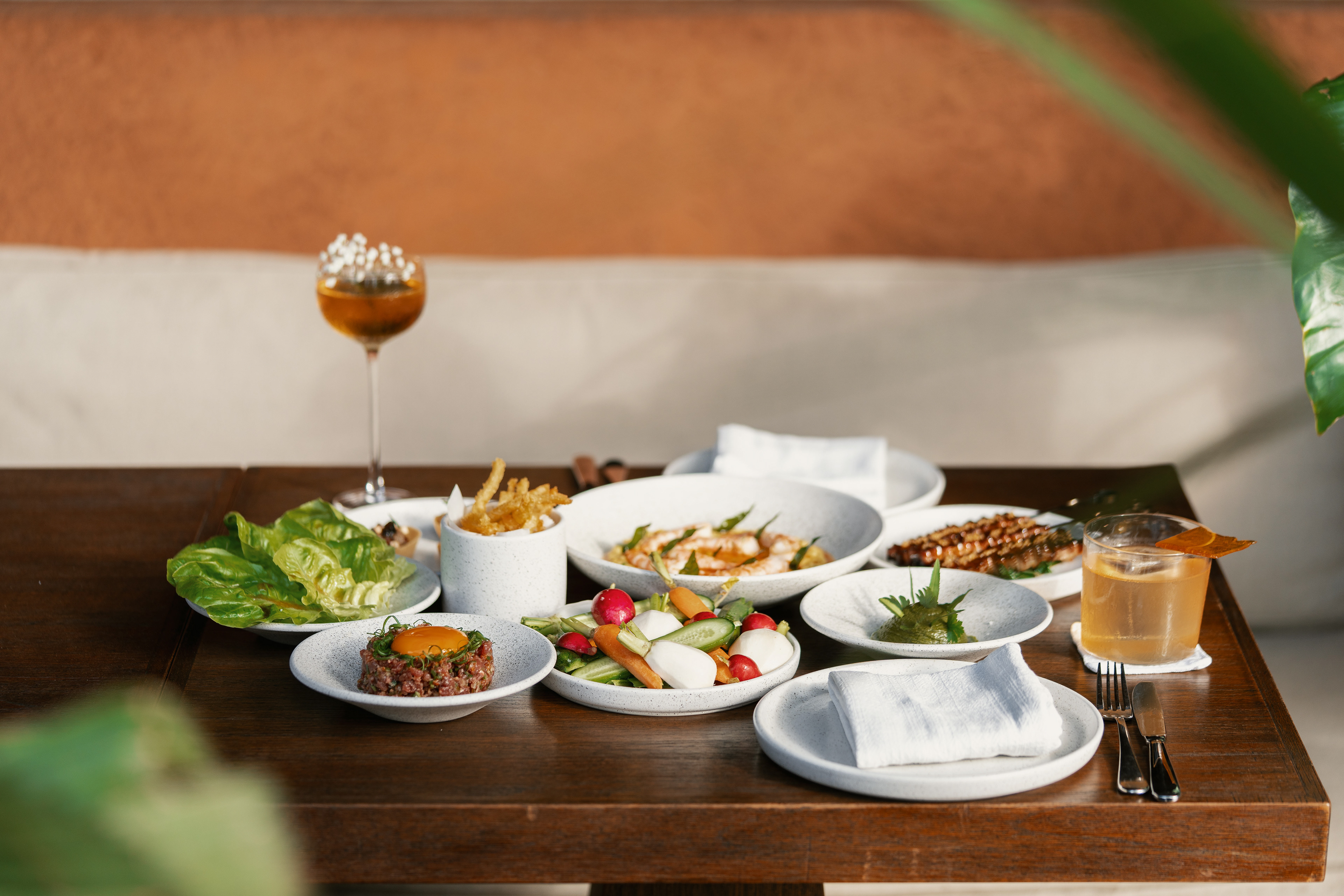 Various Dishes served on Wooden Table with Refreshing Drinks Mocktail