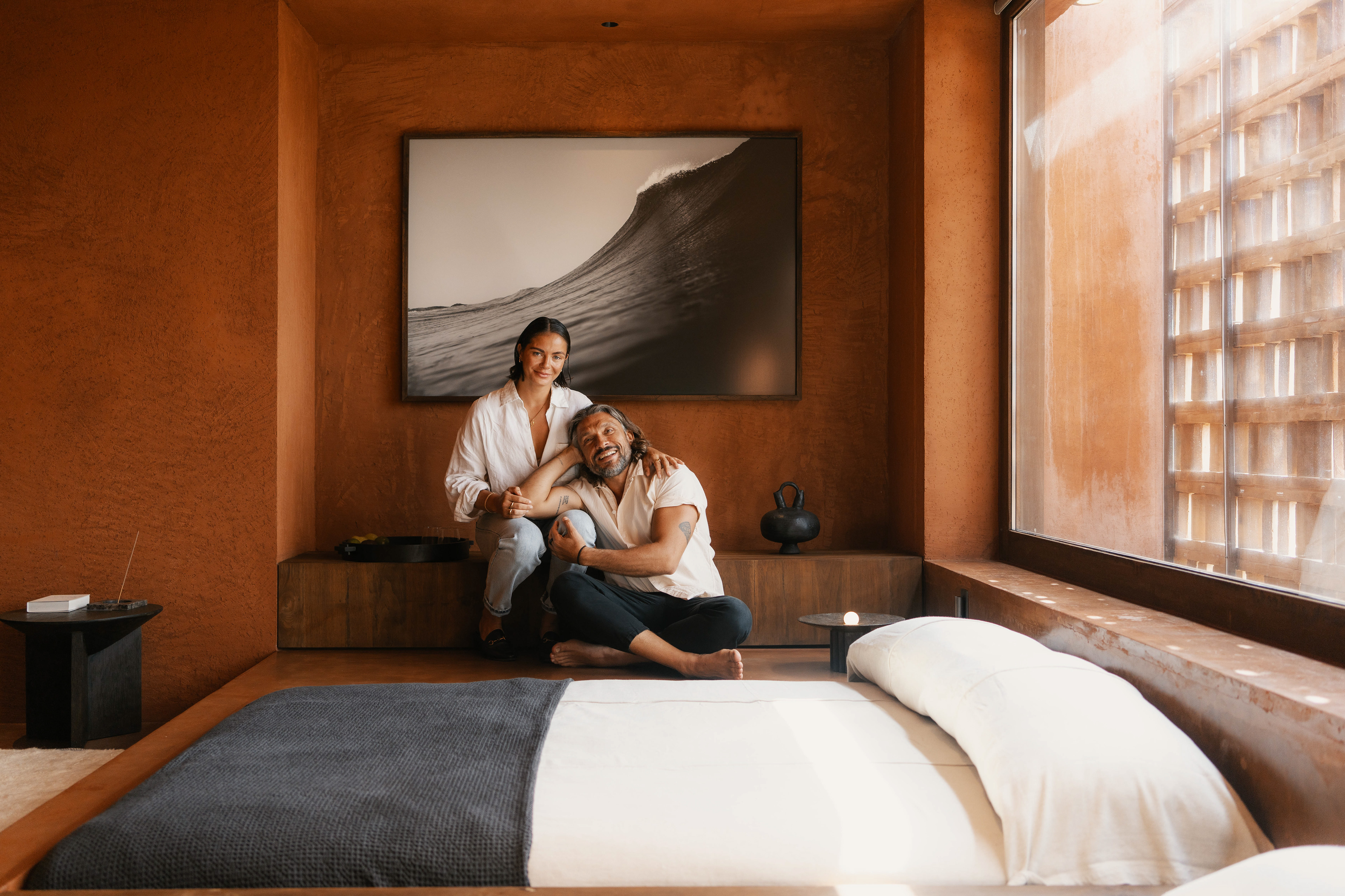 Martine And Claudio of Further Hotel Portrait in a Terracotta room