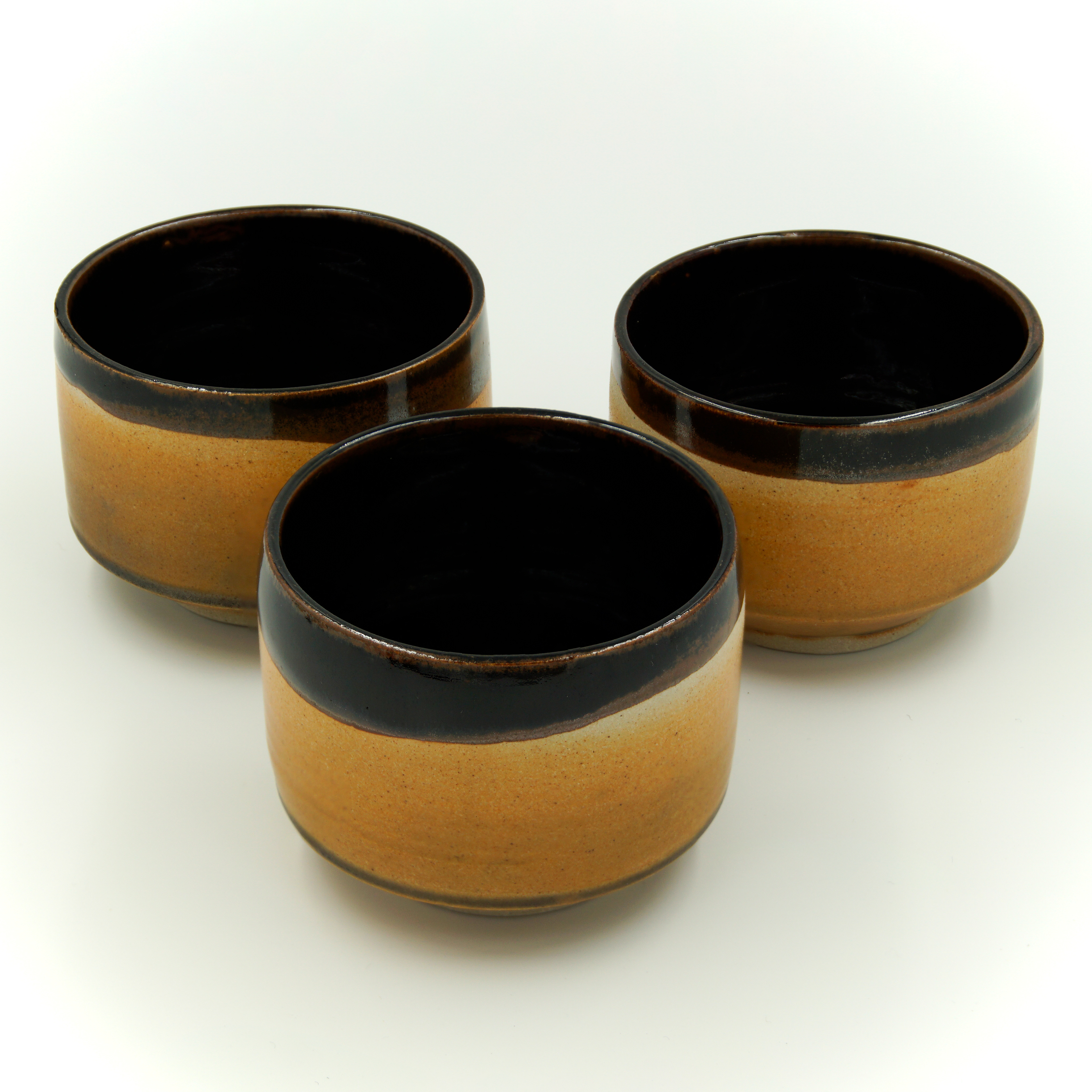 Tea bowls in tenmoku and matt black/orange glazes