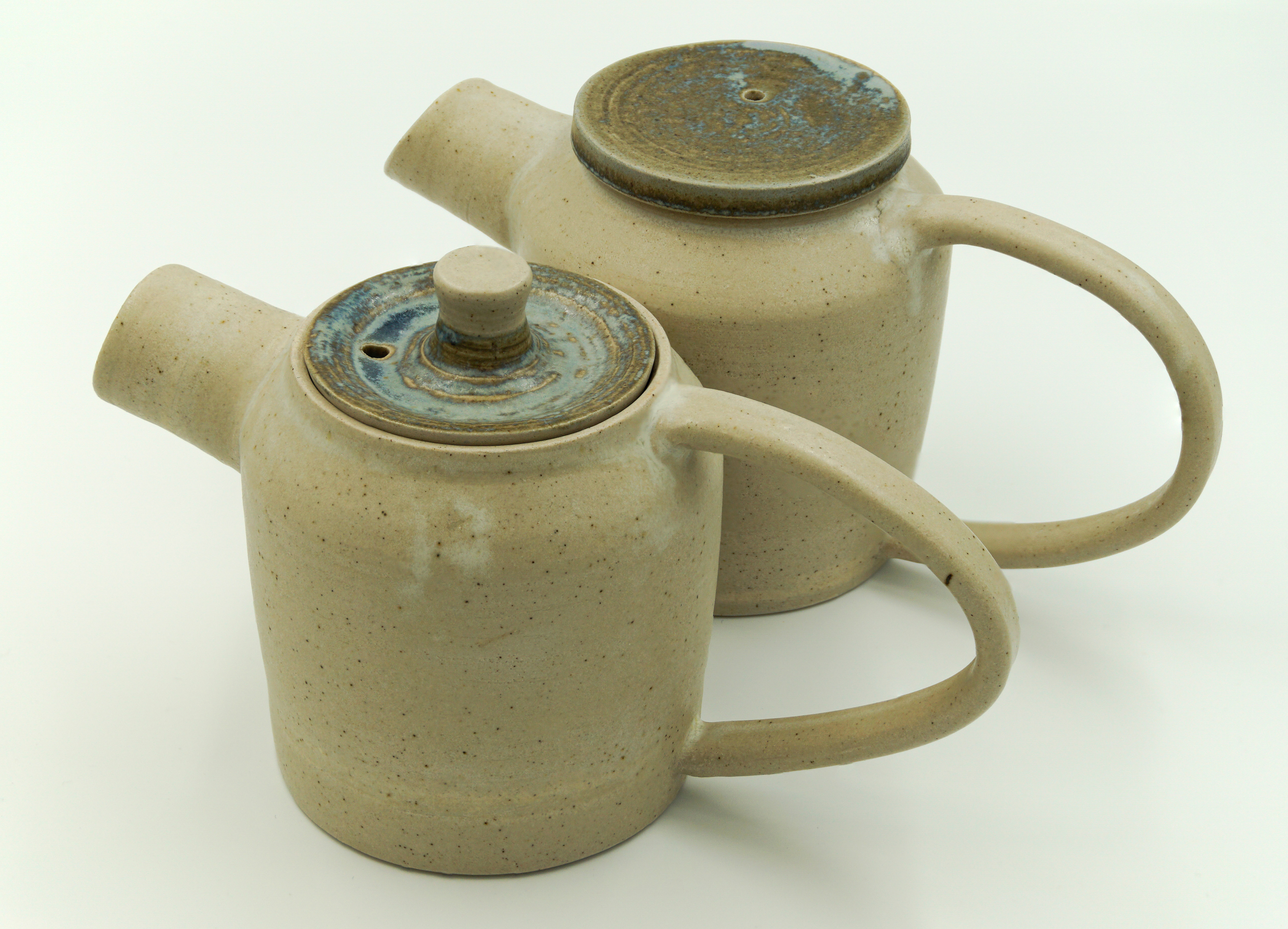 Two teapots in Dolomite and Ham blue glazes