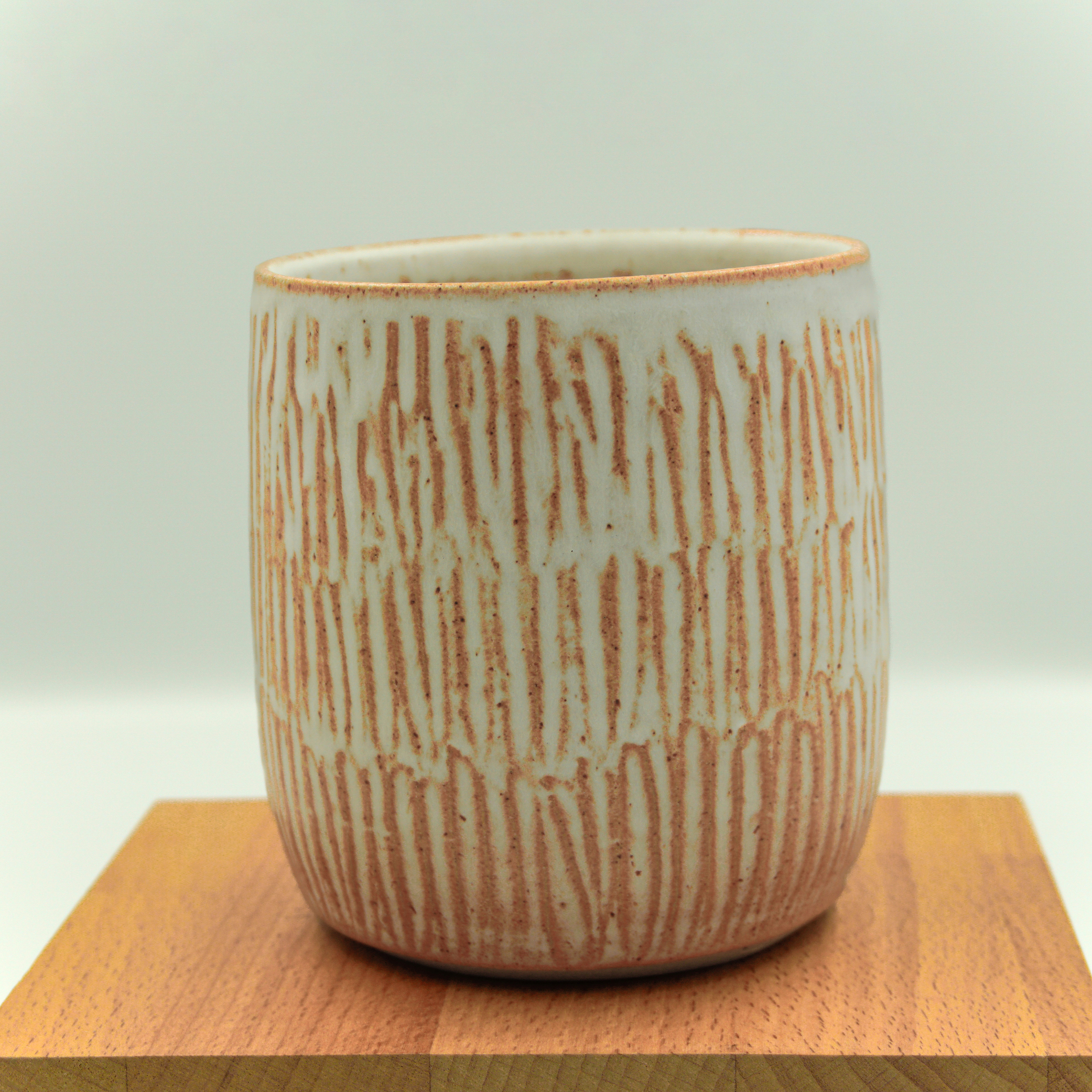 Textured pot in white/brown glaze