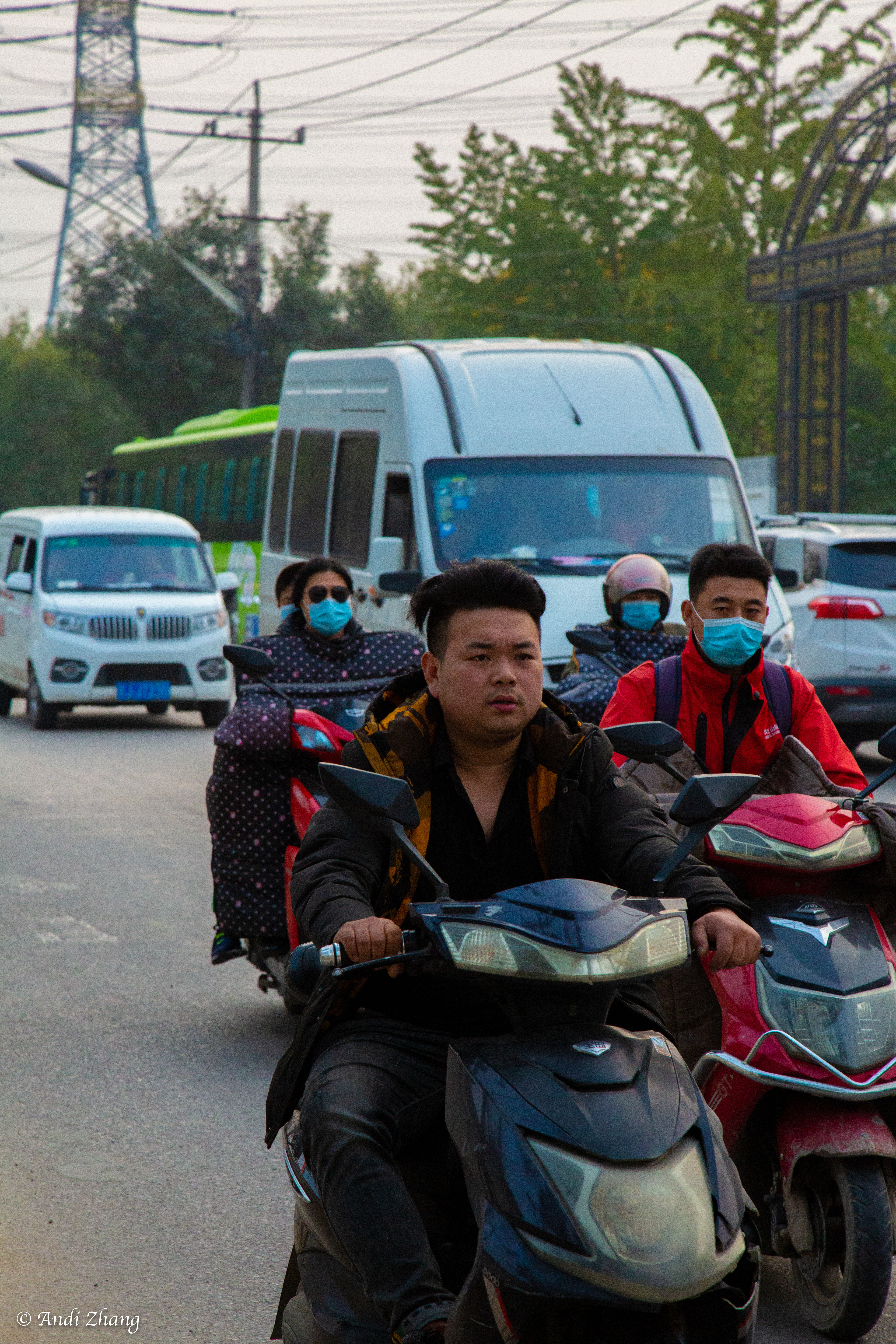 Picun Road, a dusty asphalt road in front of Picun. There are so many electric bikes on the road that they unscrupulously ride in the middle of the road. October 10, 2020.
