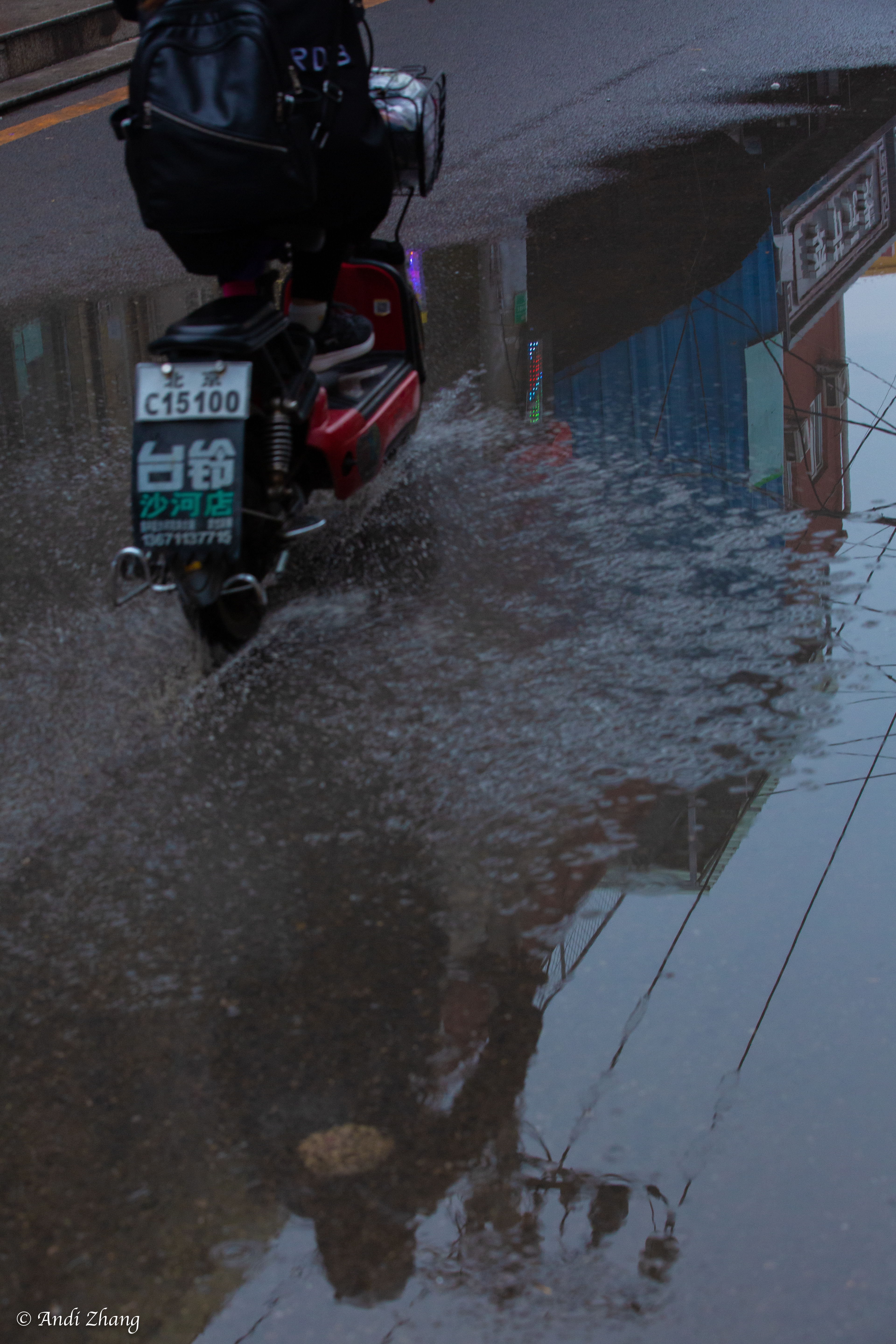 An electric bike passing a puddle. September 14, 2020.