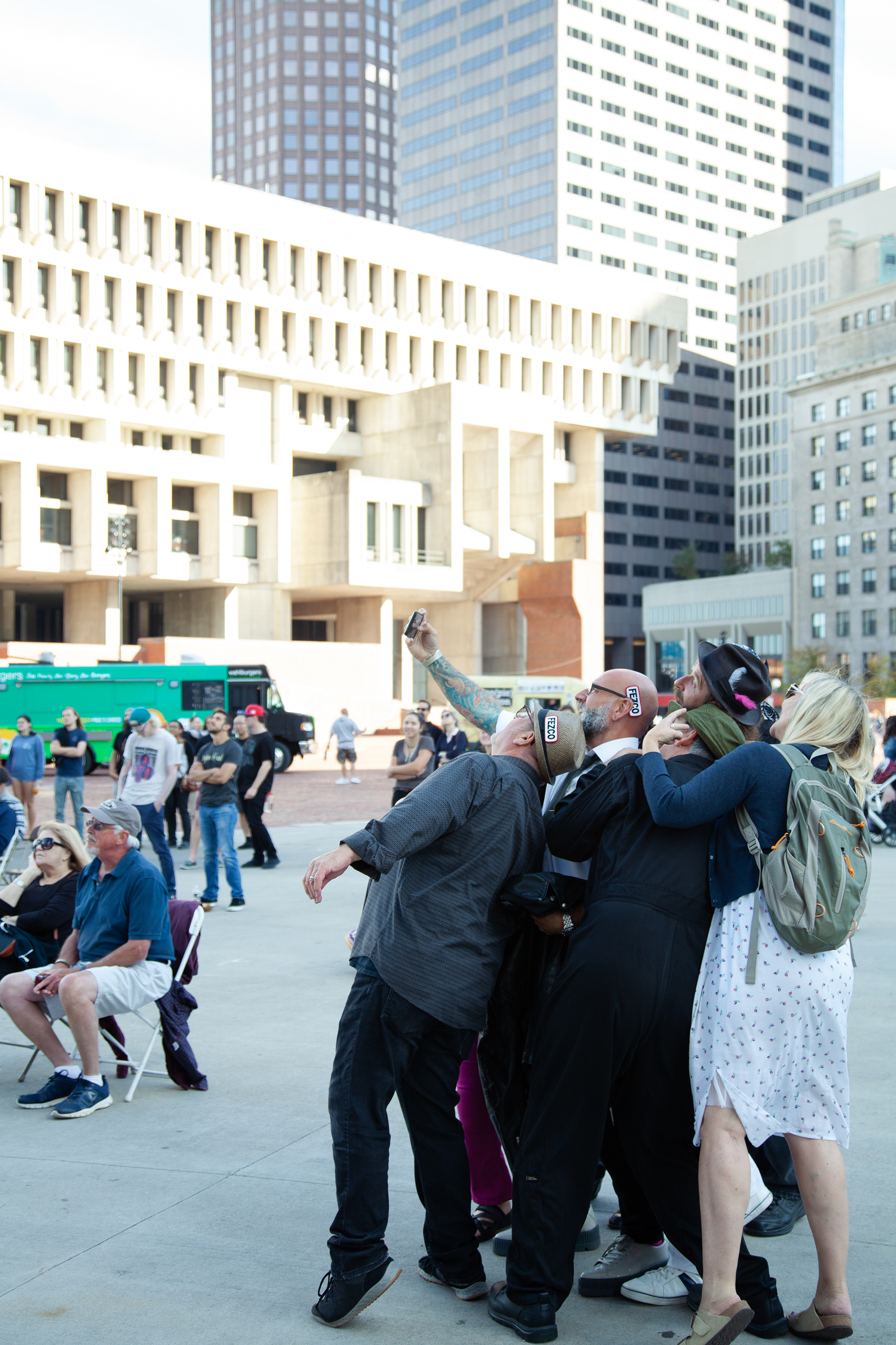 A group of audiences make their selfie in front of City Hall Plaza.
