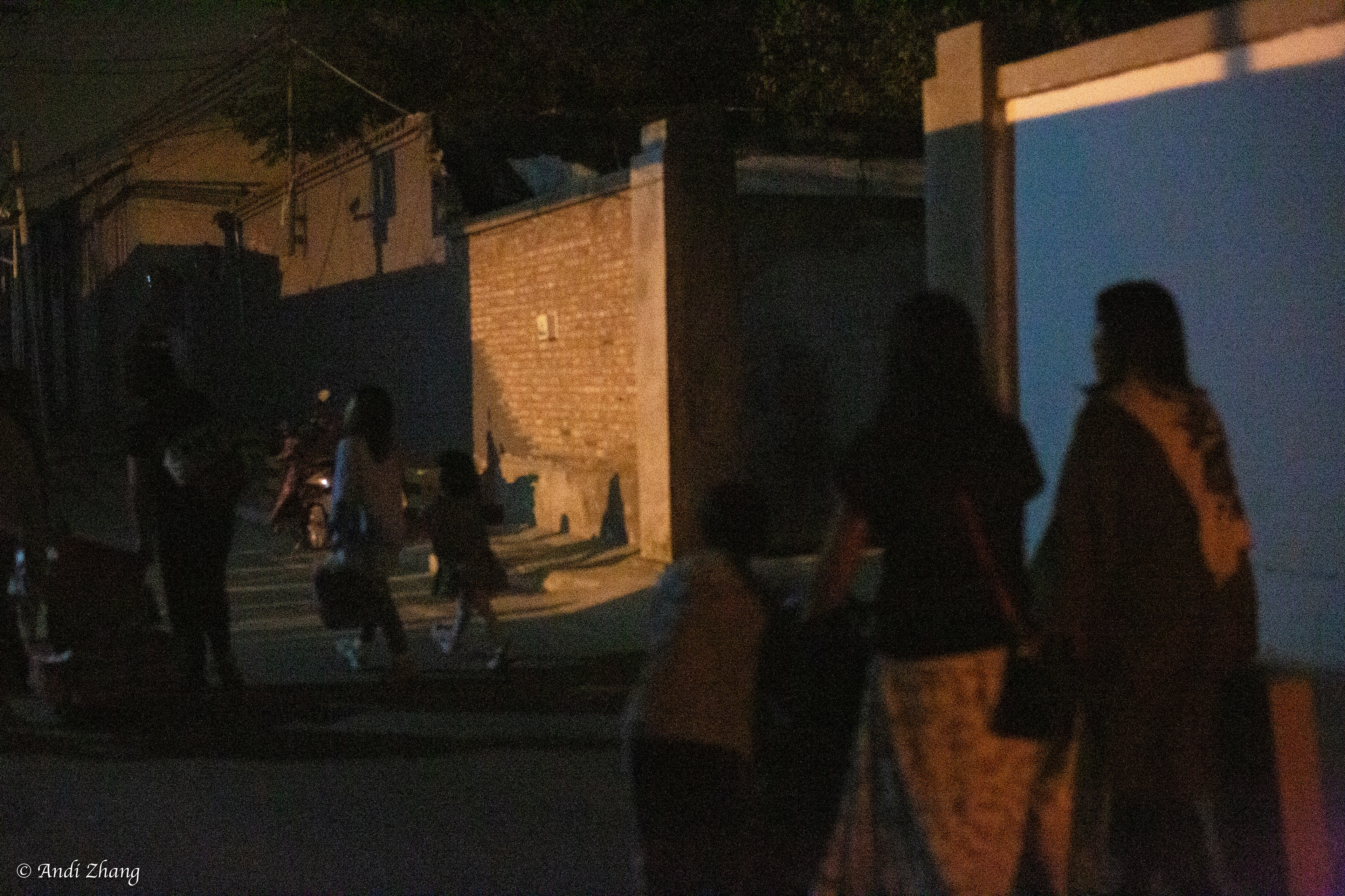 Women, surrounding by their kids, are walking towards the yard of The Home of Migrant Workers, where a fair and party for Mid Autumn Festival and National Day is held. September 26, 2020.