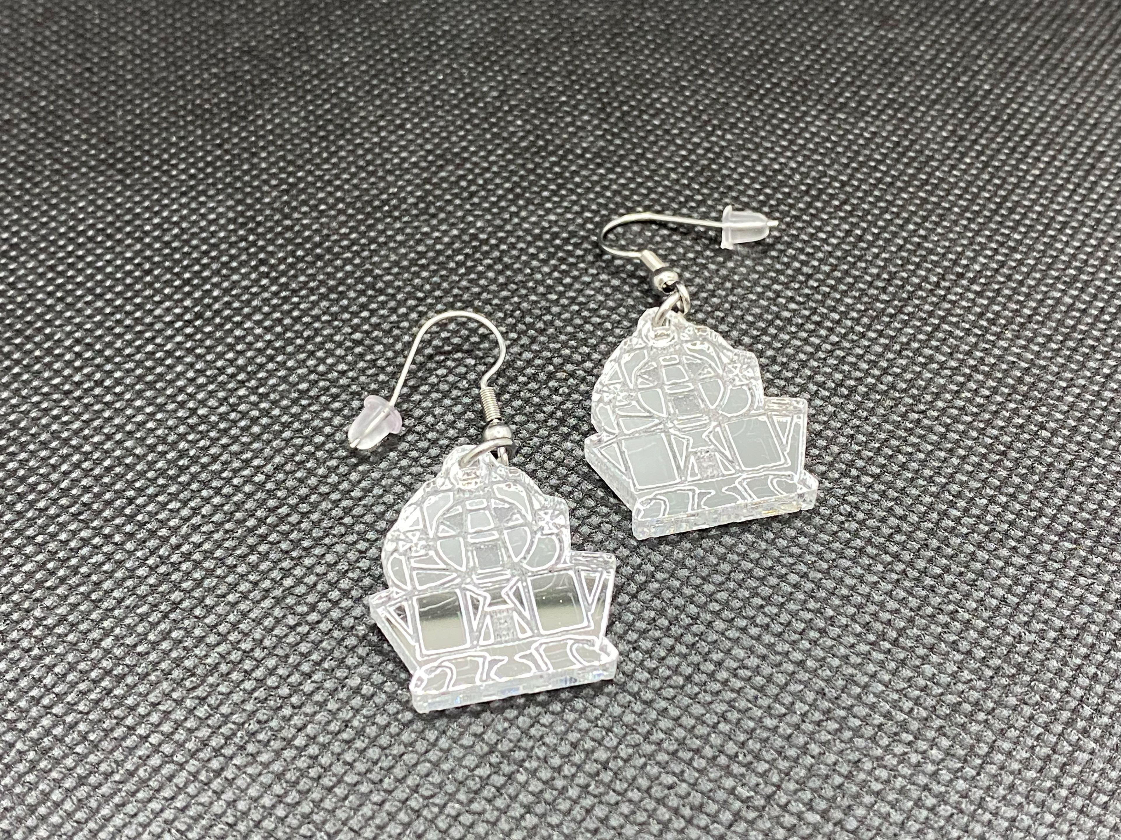 LM acrylic earrings.