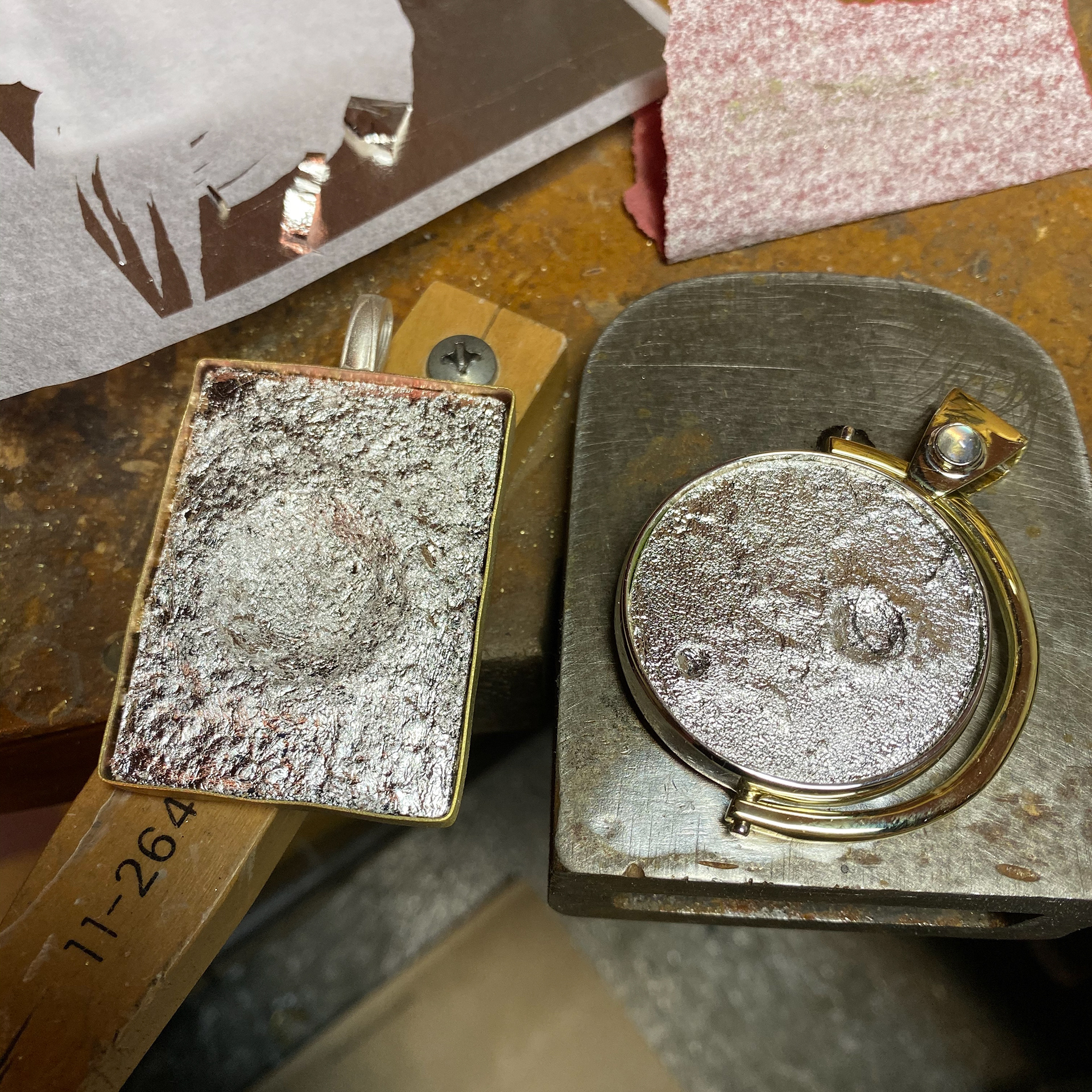 3D printed, silver leaf, silver, brass, and resin pendants.