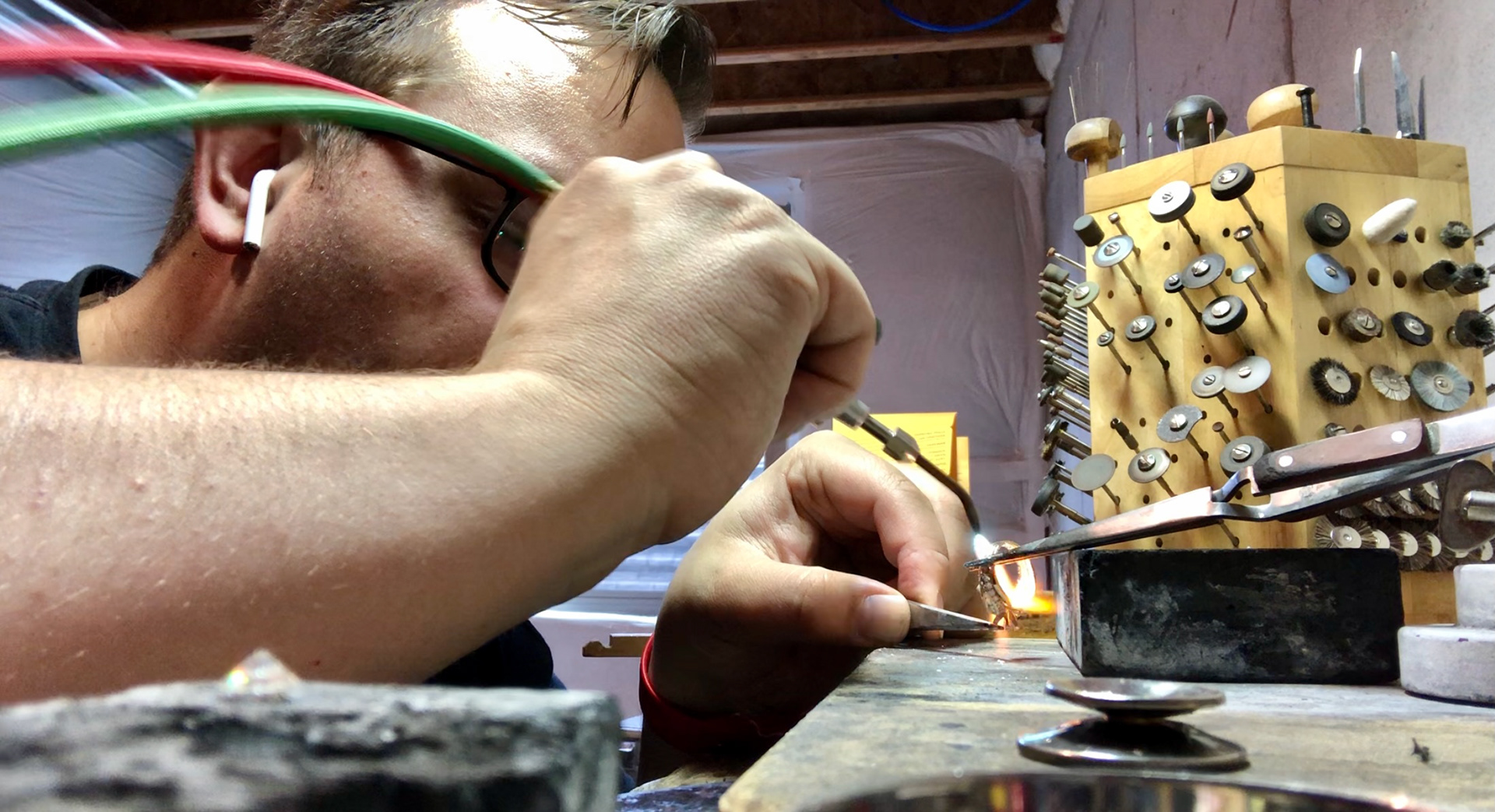 Removing a six prong head from a client's ring.