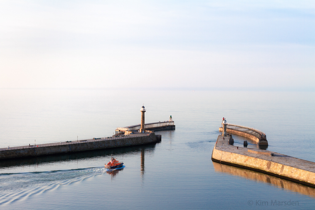 Whitby Lifeboat leaving the harbour on a very atmospheric evening