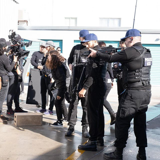 extras practicing gun manipulation