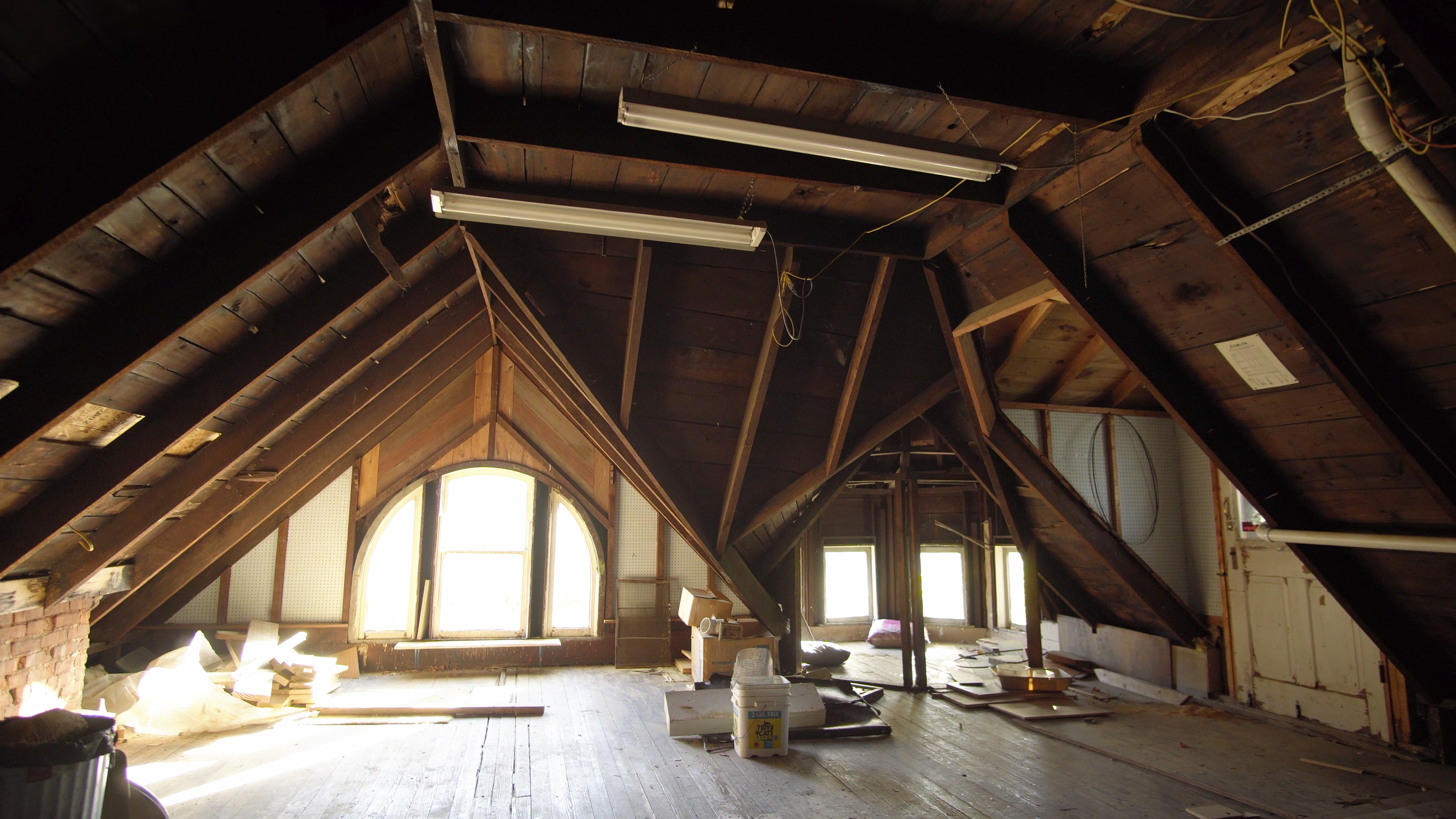 The third floor attic windows and cuppola create a charming, if unfinished, atmosphere