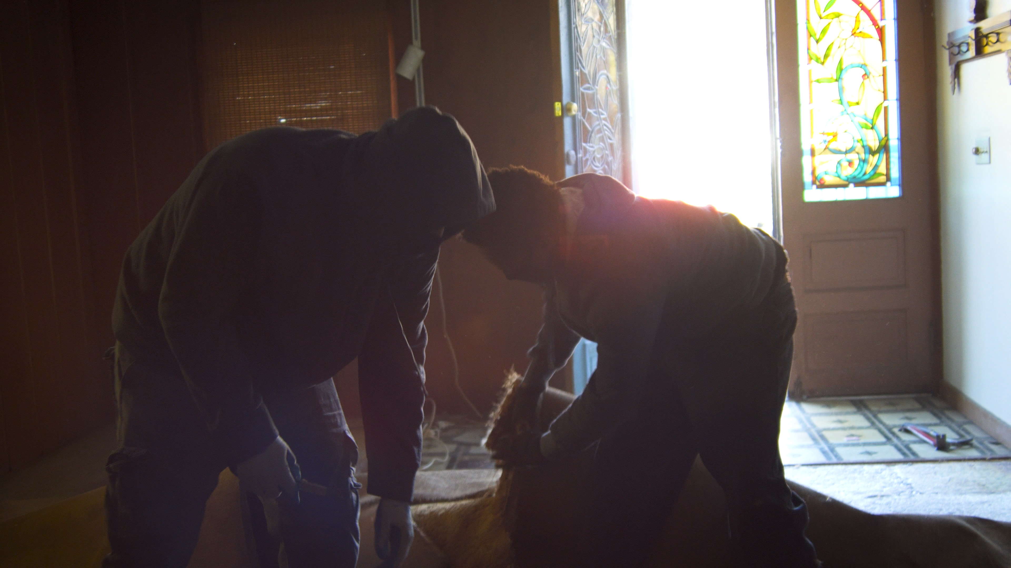The demolition team tears out the carpet
