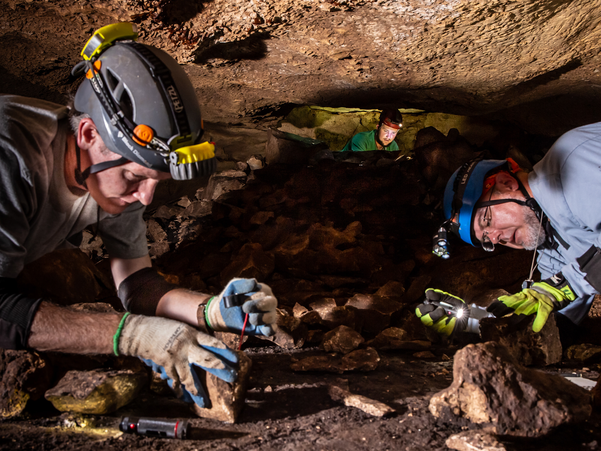 Field biologists Todd Bayless, Paul Fushille and Kenneth Sparks count endangered invertebrates in Big Tooth Cave. Austin, Texas