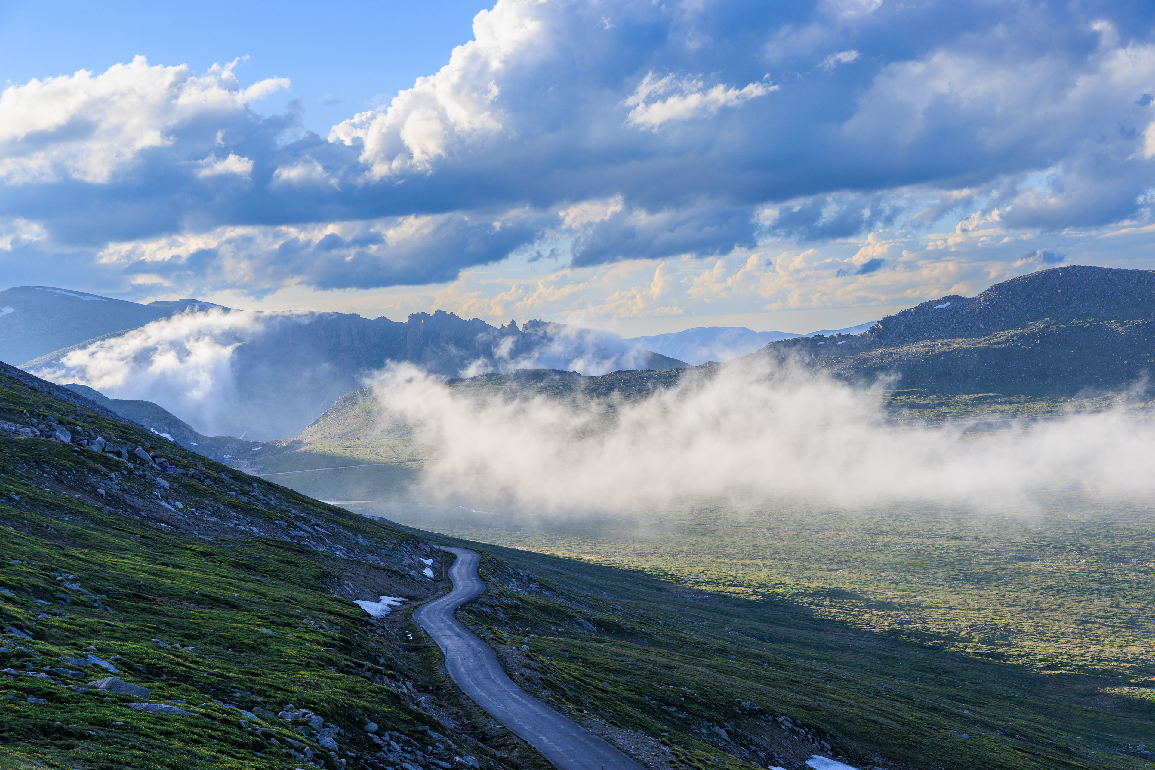 Road view to Summit Lake coming down from top of Mount Blue Sky. The weather can be very dramatic later in the day.