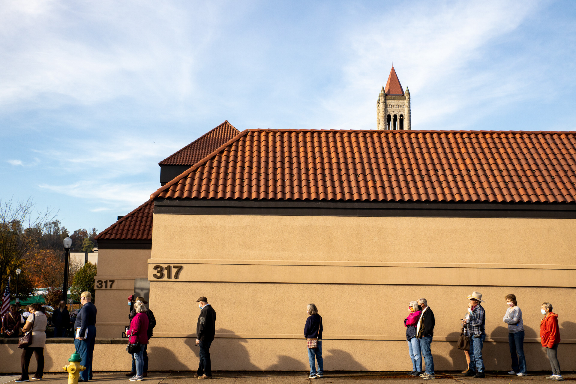 Early Voters line up outside of the Judge Black Annex polling location in downtown Parkersburg, W.Va Oct. 21, 2020. October 21st was the first day to vote early in West Virginia, and Wood County Clerk Mark Rhodes estimated receiving 127 ballots for his four polling locations within the first 45 minutes of the polls being opened. 
