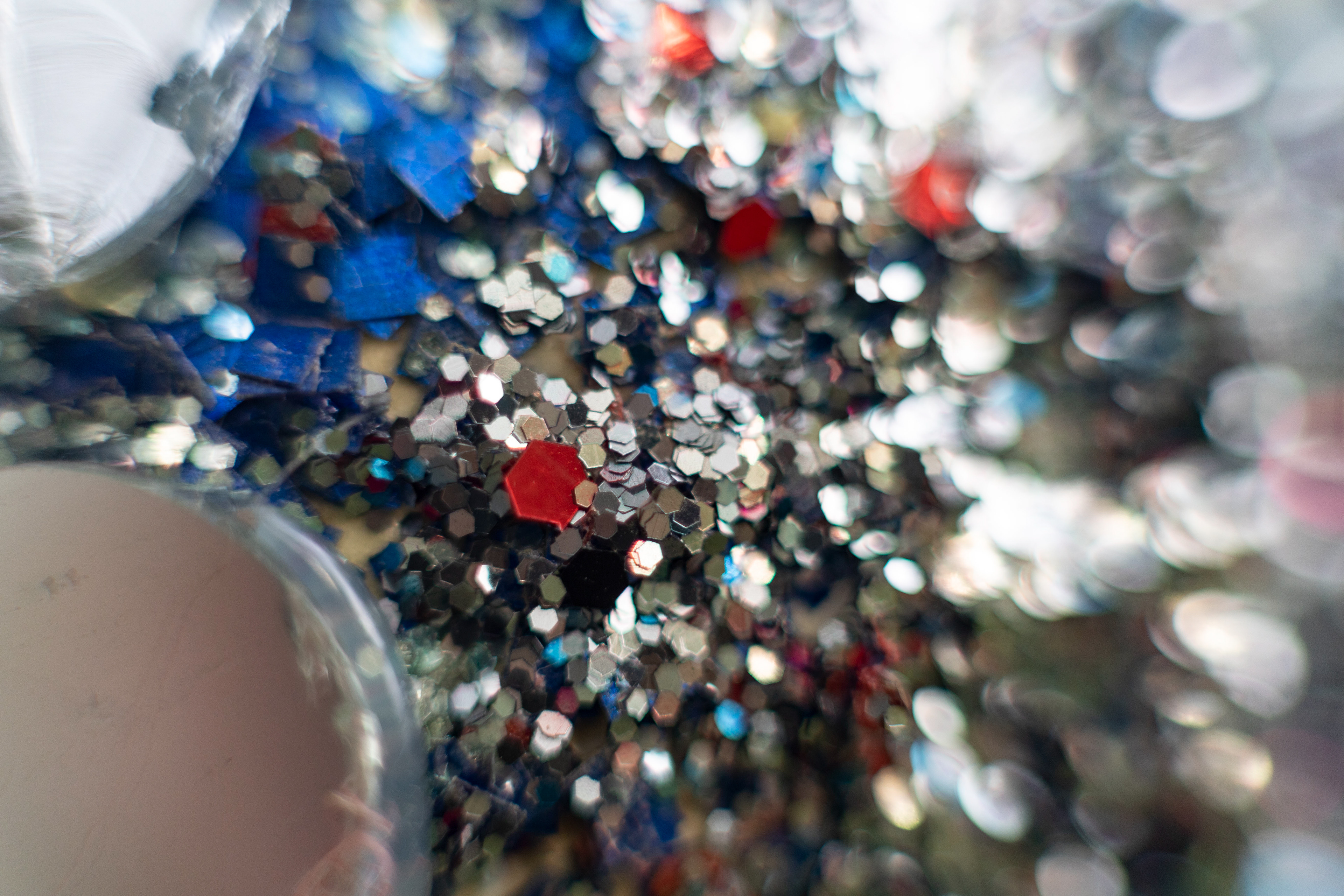 Glitter gleams from one of Bill Moore’s decoration that is hanging in his front yard in Stony Ridge on Wednesday October 13, 2021.