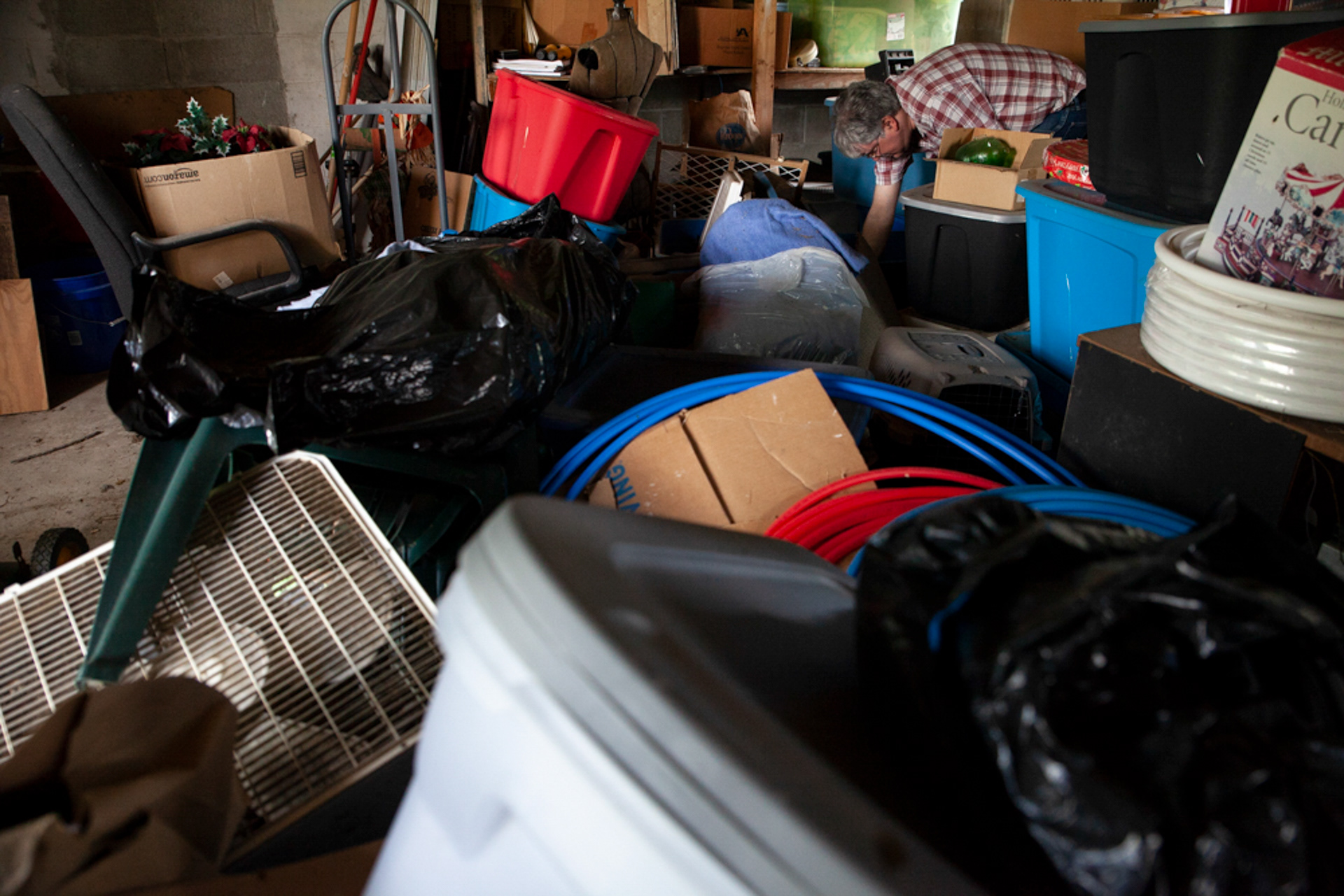 Christopher Ewing rummages through his back shed, in Albany, Ohio, looking for hexes that will protect him from Virgil, the man who enslaved him in Pennsylvania Dutch country from the time he was 18 until he was 19. Ewing paid a witch to put a hex on Virgil, which allowed Ewing to escape. "His clothes were ripped and he had blood on his forehead," Ewing says as he remembers the day he won his freedom. "He tried to jump me when I was coming out of the beer garden, so I took off."