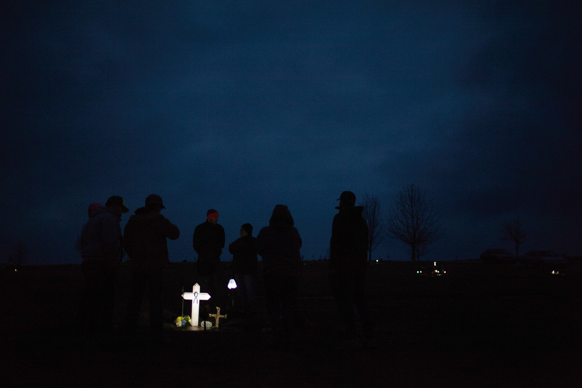Family and friends gather round Jeffrey Tylor Gillette's gravestone marking the one memorial of his death, Alexander, Ohio, Mar 2, 2019. After six months of chemo, Gillette died at the age of 26 of cancer in his kidney.