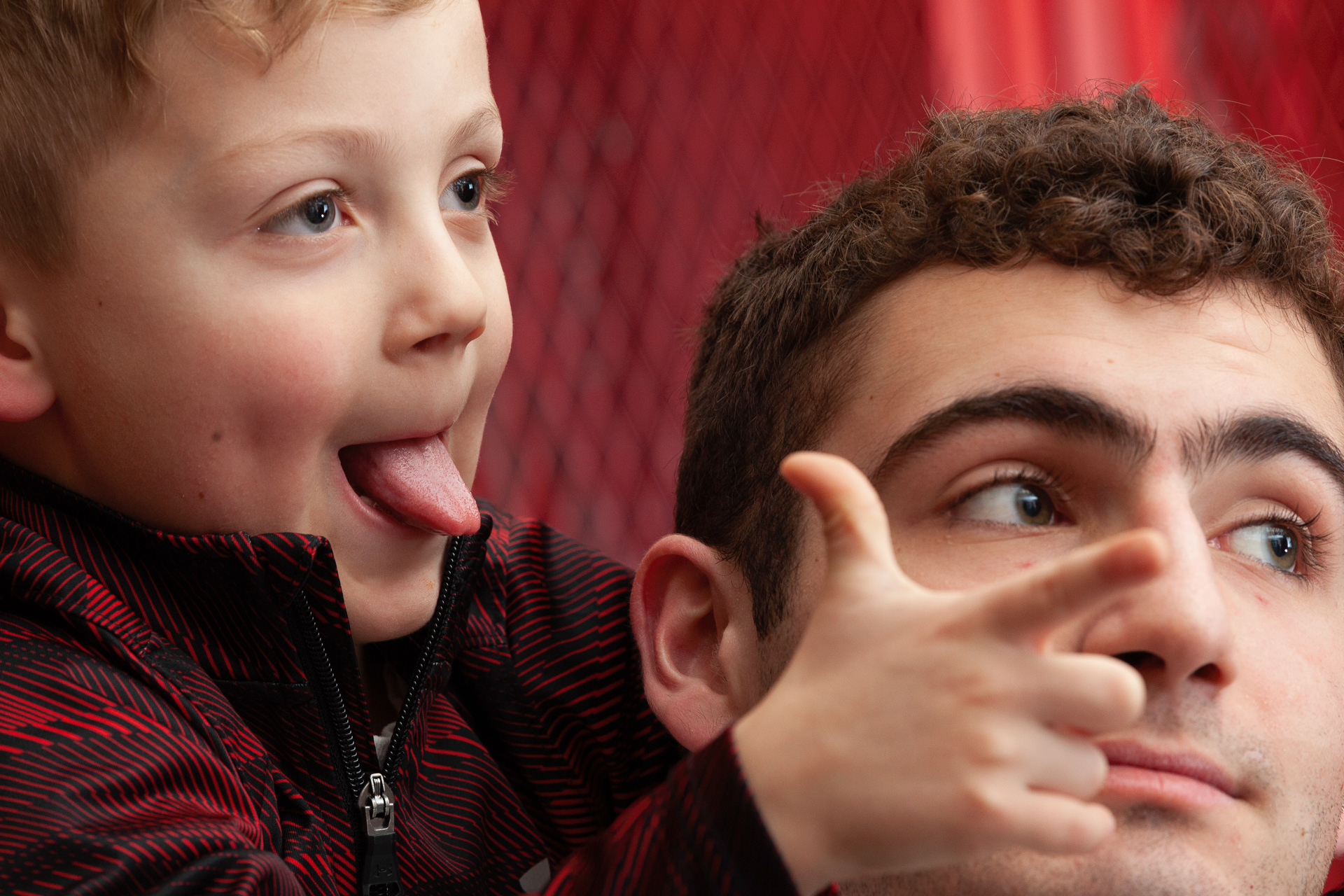 Brothers Strong Irwin, 4, of Albany, Ohio, and Stone Markins, 17, of Albany, Ohio, pose for senior photos Erica Matheny in the Alexander High School men's locker room, Alexander, Ohio, Feb 10, 2019.
