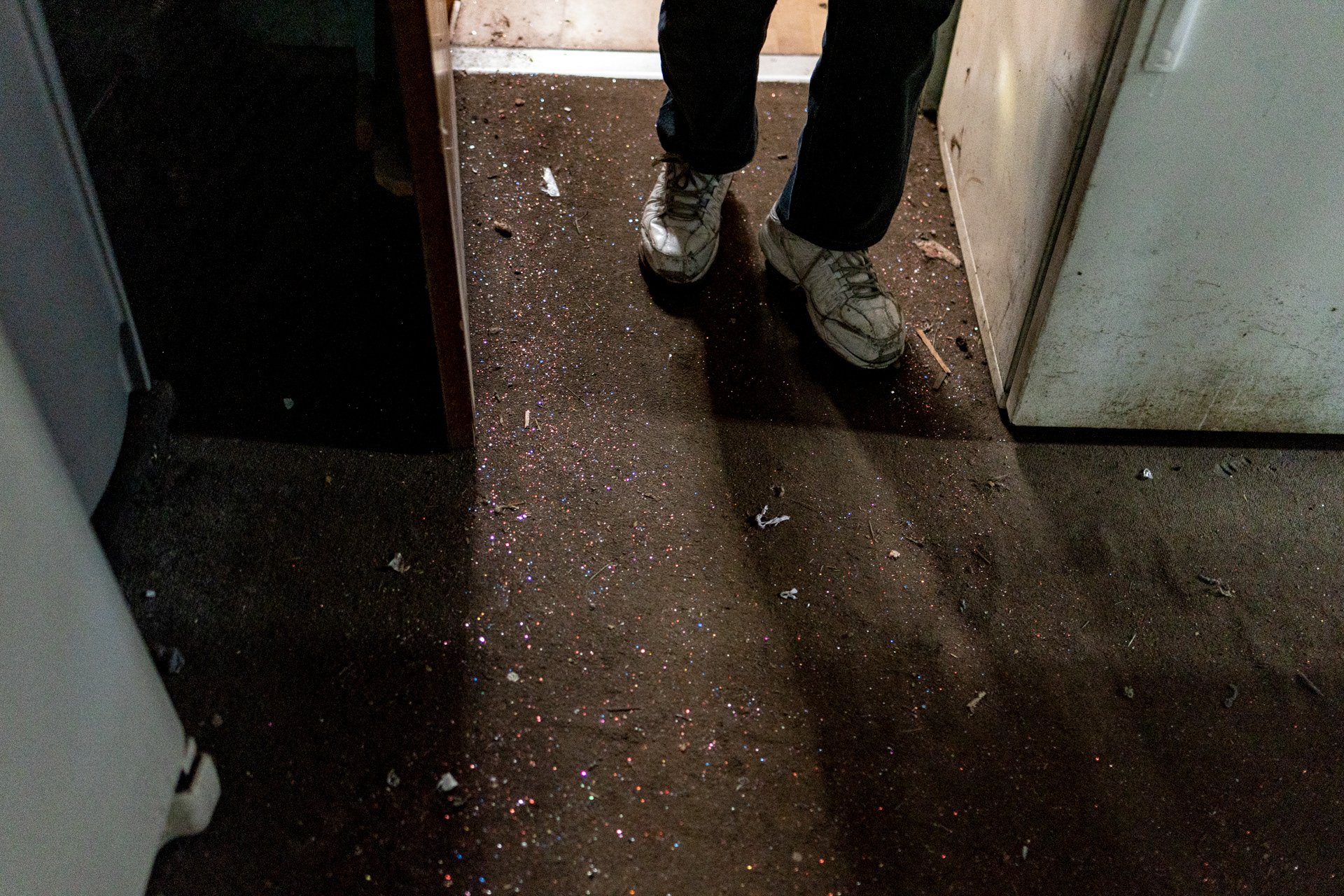 Bill Moore, 87 of Stony Ridge, Ohio, walks to his garage that is covered in glitter from his decoration projects in Stony Ridge, Ohio on September 29, 2021. Moore started making glittery decorations as a way to cope with the loss of his wife to brain cancer.
