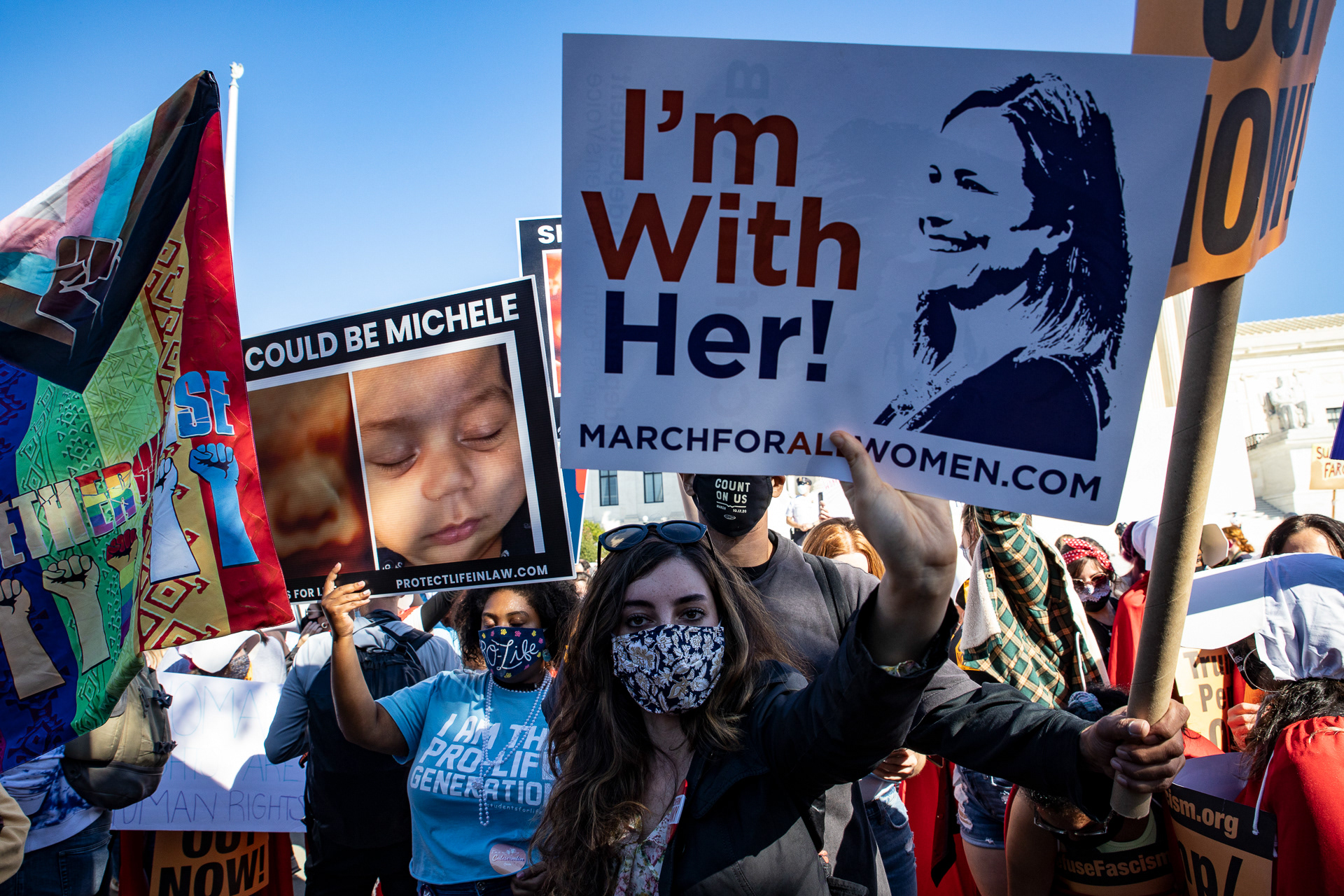 Counter protesters of the Women's March vie to display their signs in support of Amy Coney Barrett and anti-abortion sentiments in front of the United States Supreme Court in Washington, D.C. on Oct. 17, 2020. The Women’s March, a feminist organization, planned a rally and march to bring opposition against President Donald Trump and Trump’s plans to fill the Supreme Court seat left by Ruth Bader Ginsburg, but was met with its own opposition from the conservative Students for Life anti-abortion group,  who planned their own “March for All Women”. 