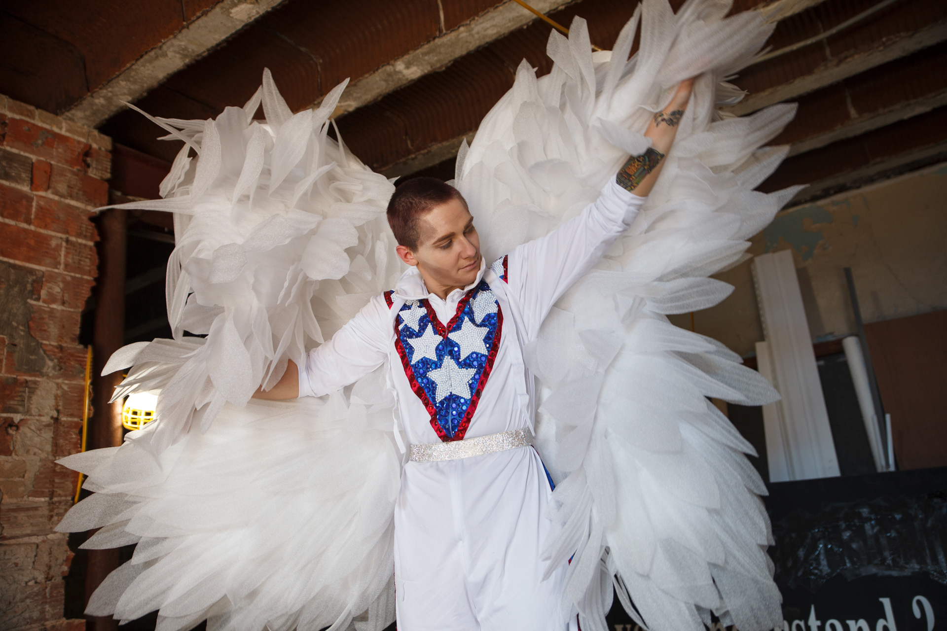 Fyyrestorm prepares for their drag performance to the song “I’m still Standing” by Elton John in a building adjacent to the drag performance area in Columbus, Ohio on June 13, 2021. Nick Wolack, a local businessman owns the building, and allowed SoHud Collective performers to ready themselves in the stripped down building before the show.