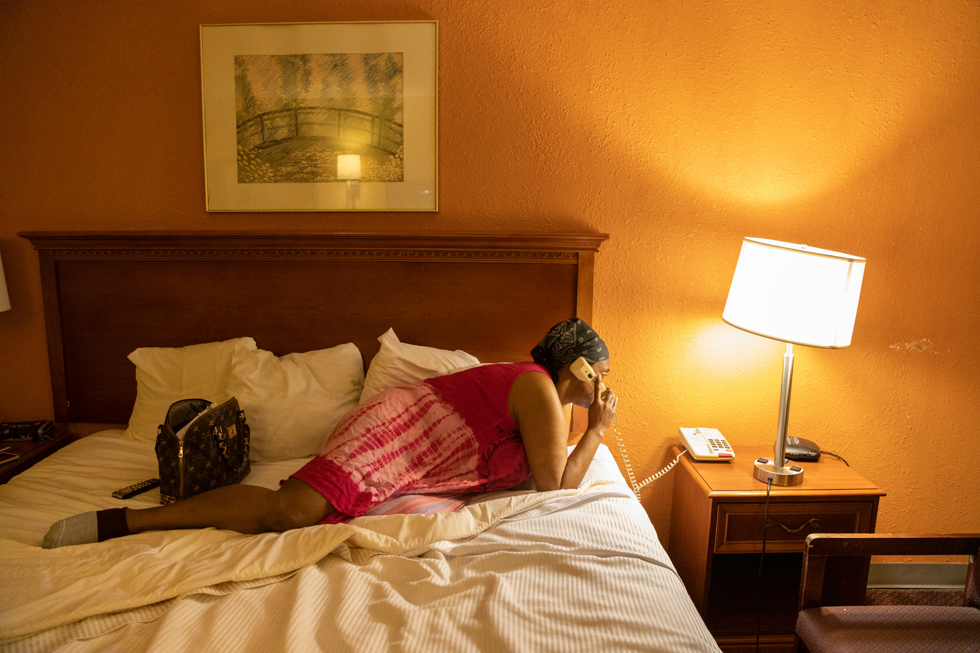 Shanta Thomas, 44, of Columbus, Ohio receives a phone call from her neighbor in a hotel after being evicted from her apartment in Columbus, Ohio on on March 2, 2021 . One of Thomas’s neighbors, Mohammed Ali, paid for her to stay in the hotel for four nights, so she could figure out a different housing situation.