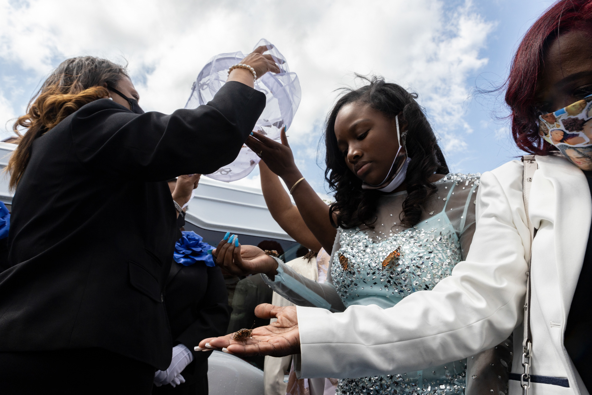 Grandmother of Ma’Khia Bryant, Jeanene Hammonds of Columbus, Ohio (Right), stands with one of the sisters of Ma’Khia Bryant while they release butterflies into the air during funeral for Ma’Khia Bryant in Columbus, Ohio on April 30, 2021.