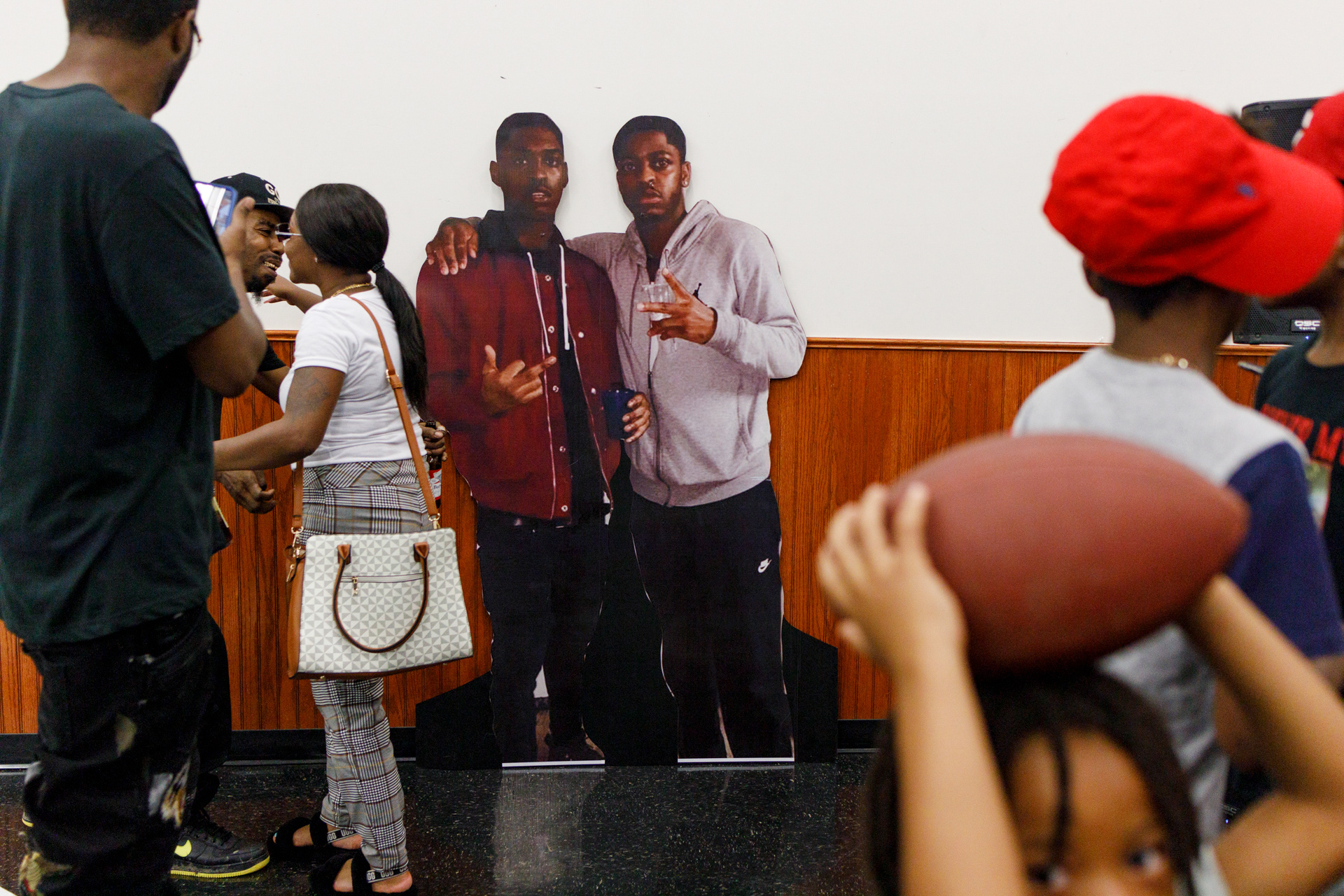 A large cardboard cutout of Jerick Jacobs-Tate (L), 23, and his brother Jaleel Carter-Tate (R), 25, who both died of gun violence, is seen at the reception hall for Jerick Jacobs-Tate's funeral in Columbus, Ohio, U.S., August 17, 2021.