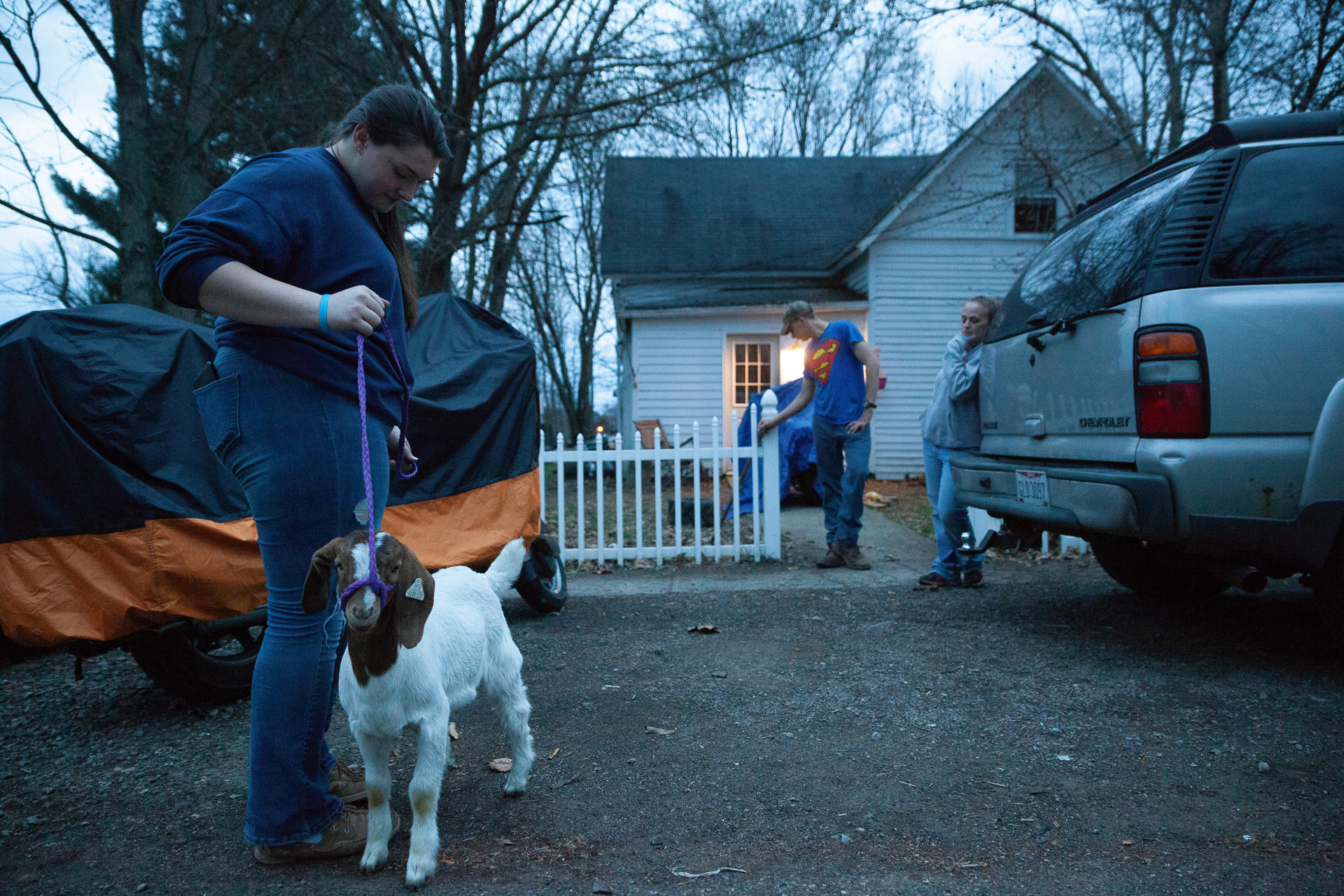Erin Steenrod, 15, of Albany, Ohio, walks her pet goat, Champ, along with her mother, Veronica Steenrod, of Albany, Ohio, and her step brother, Owen Howard, 17, of Albany, Ohio, Mar. 30, 2019. Steenrod cultivates her goat as a part of the 4-H program, which teaches life skills to students in high school.