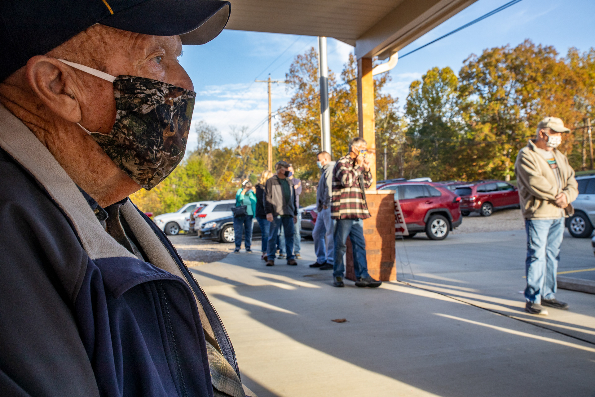 Robert Watkins, 88, of Lubeck, W.Va sits while waiting to cast his ballot during early voting outside of the Blennerhassett Fire Department, a polling station in Parkersburg, W.Va on Oct. 21, 2020. October 21st was the first day to vote early in West Virginia, and Wood County Clerk Mark Rhodes estimated receiving 127 ballots for his four polling locations within the first 45 minutes of the polls being opened. 
