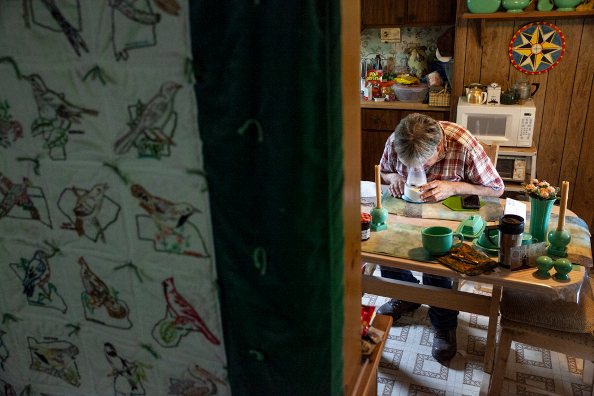 After an hour of looking through old items in his shed for a protective hex against Virgil, Christopher Ewing developed a nasty and persistent cough that caused him to take a moment to clean out his sinuses with a vaporizer in his kitchen in Albany, Ohio. "It’s round and has like a star in the center," says Ewing as he describes the hex, and then points to the one above his microwave.