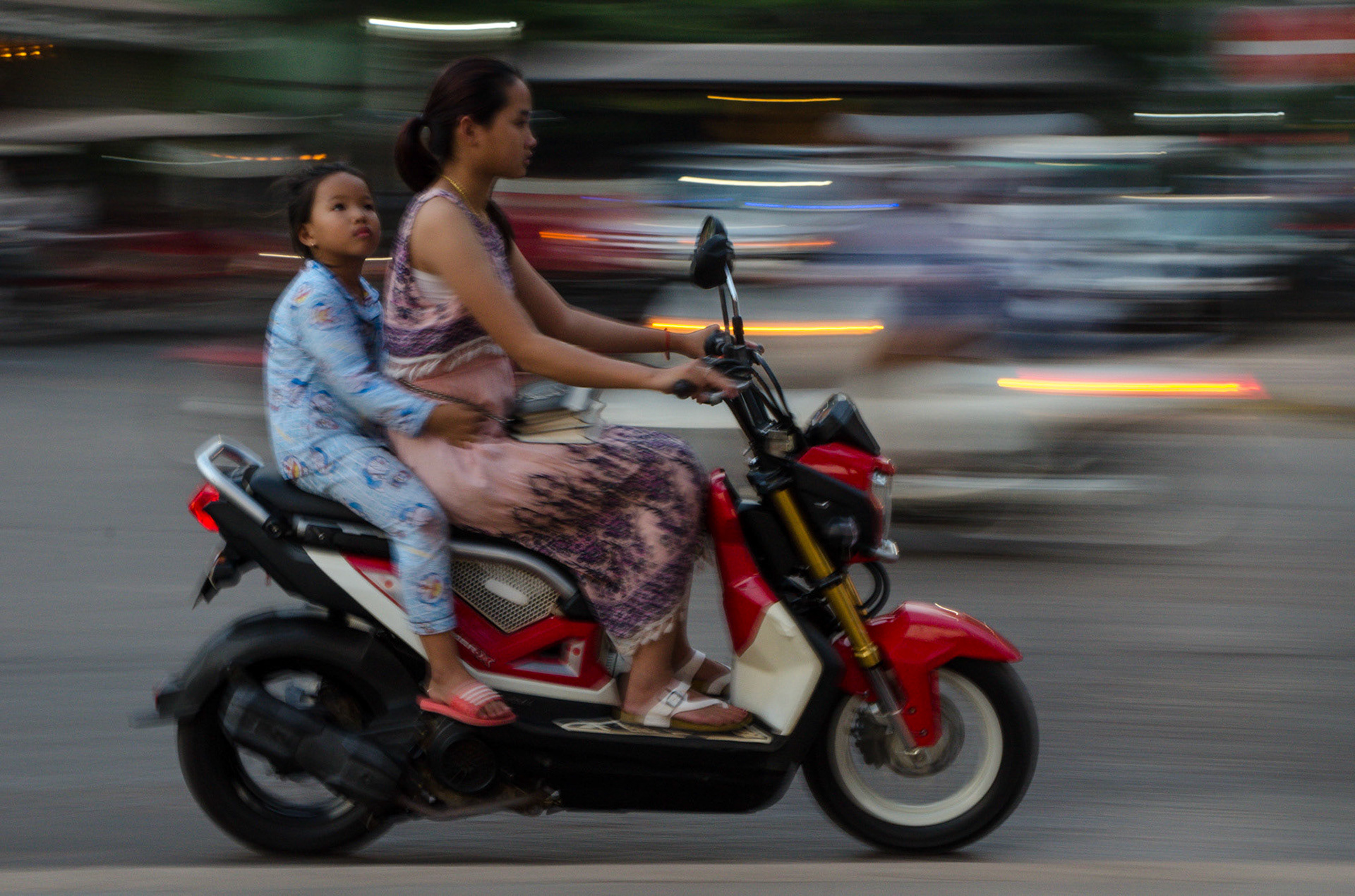 Mother and child on motorbike, Cambodia