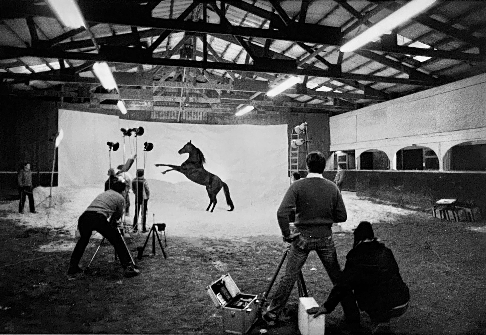 Production still giving an idea of the amount of personnel, equipment and location resources necessary for the Busch Stallion photography. Shot with a 4x5 camera.