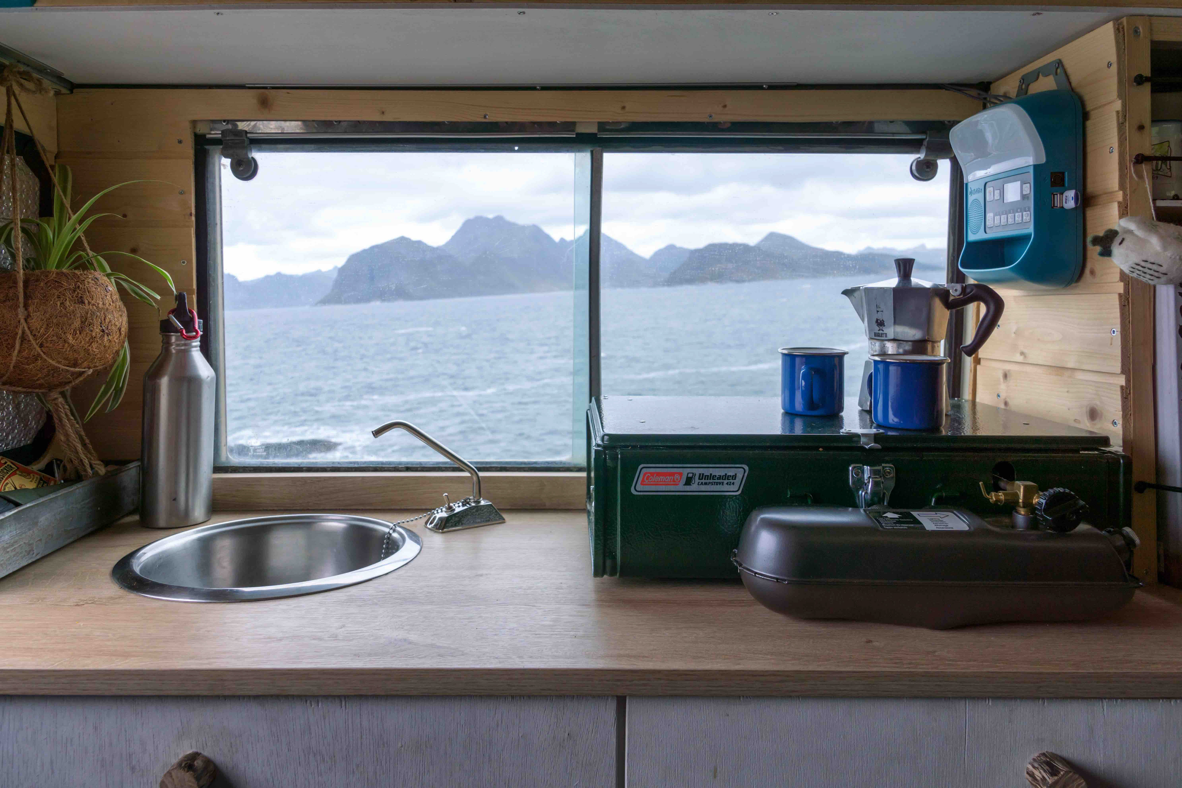 Land Rover camper interior coleman 424 2-burner stove and sink