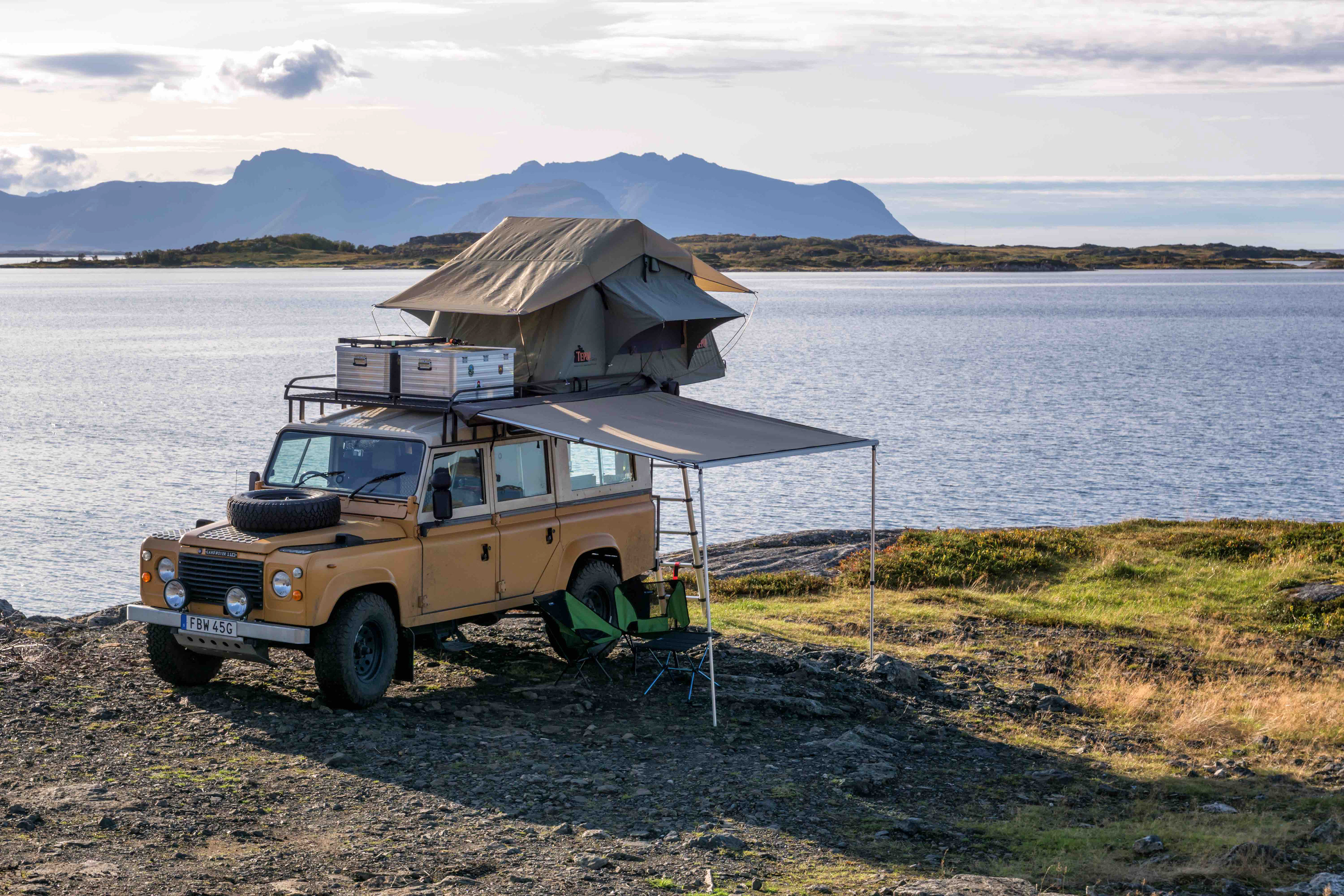 Land Rover Defender with rooftop tent and side awning