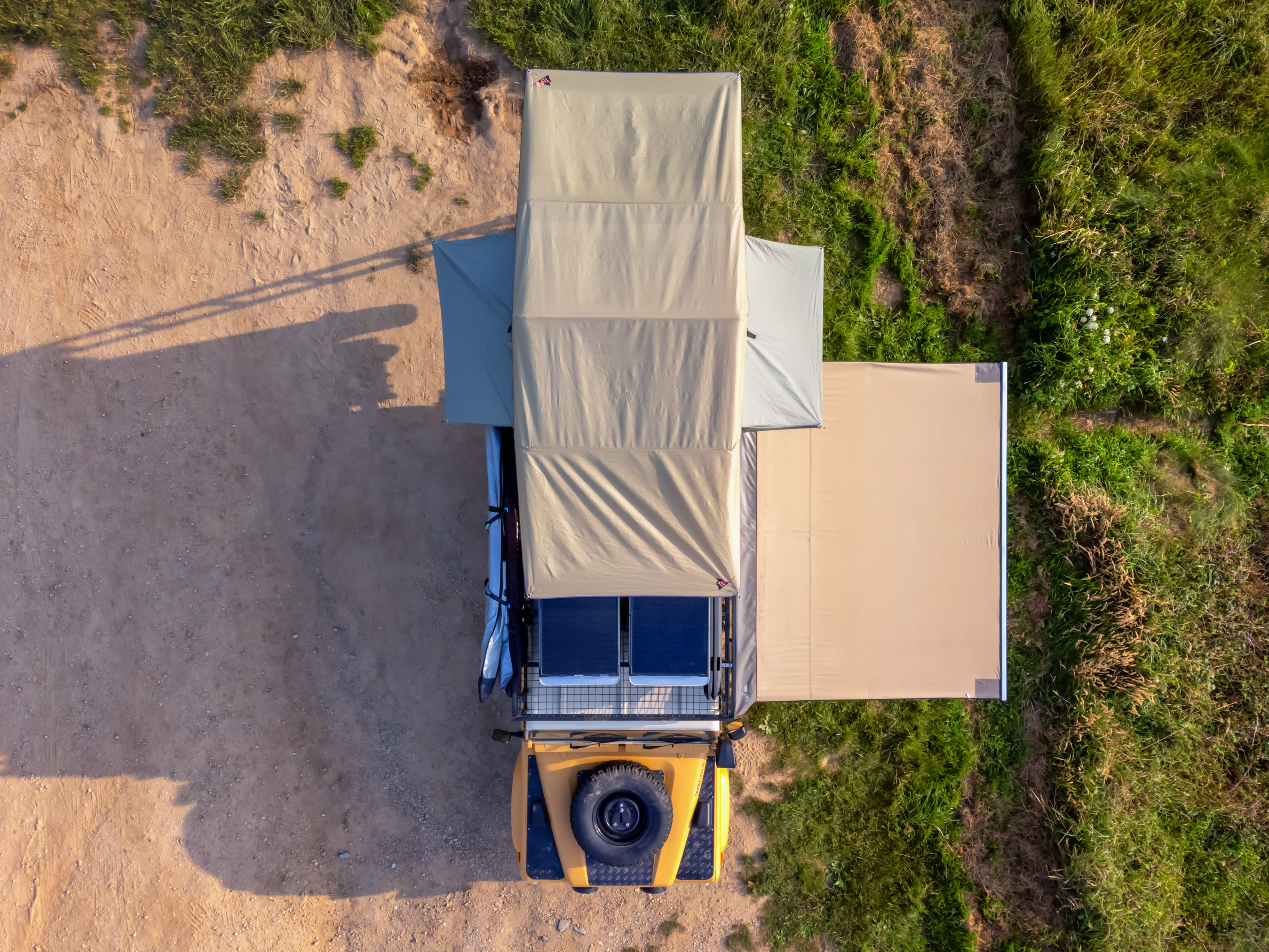 Land Rover Defender with rooftop tent and side awning